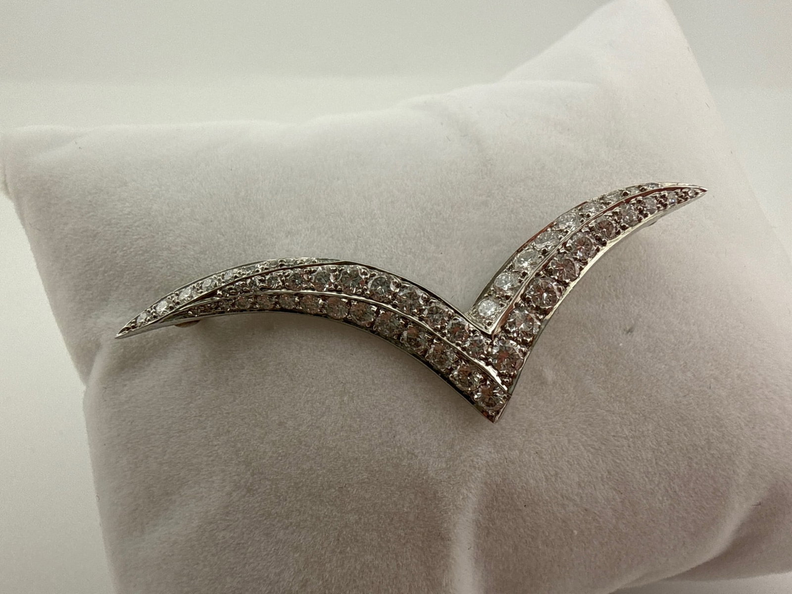 Tiffany & Co. Platinum & Diamond Brooch: A Tiffany & Co. platinum and diamond seagull brooch. 2in long x 5/8in tall. 3.3 dwt. | You have additional shipping options, and are not required to use Live Shipping. Additional third-party shipper d