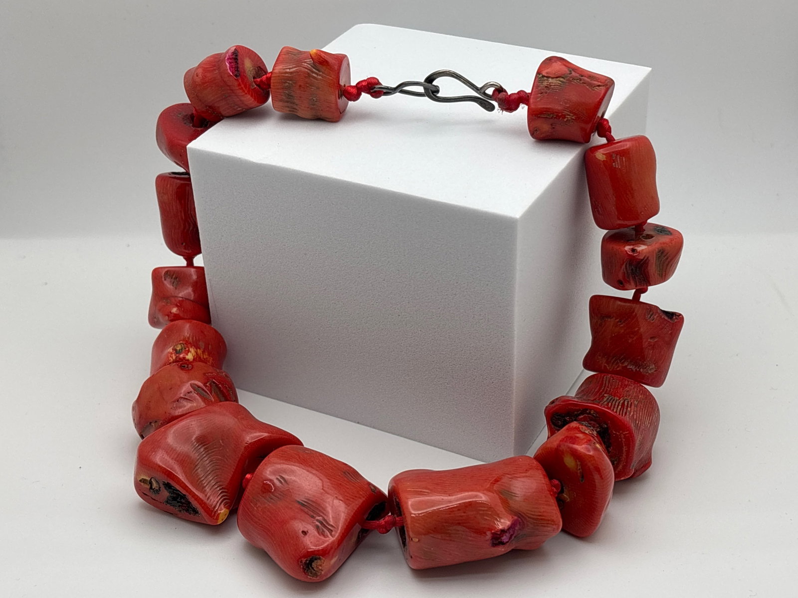 Red Branch Coral Statement Necklace: A red branch coral statement necklace attributed to Rebecca Collins, on a hand-knotted cord with silver fishhook clasp. 18in long. | You have additional shipping options, and are not required to use L