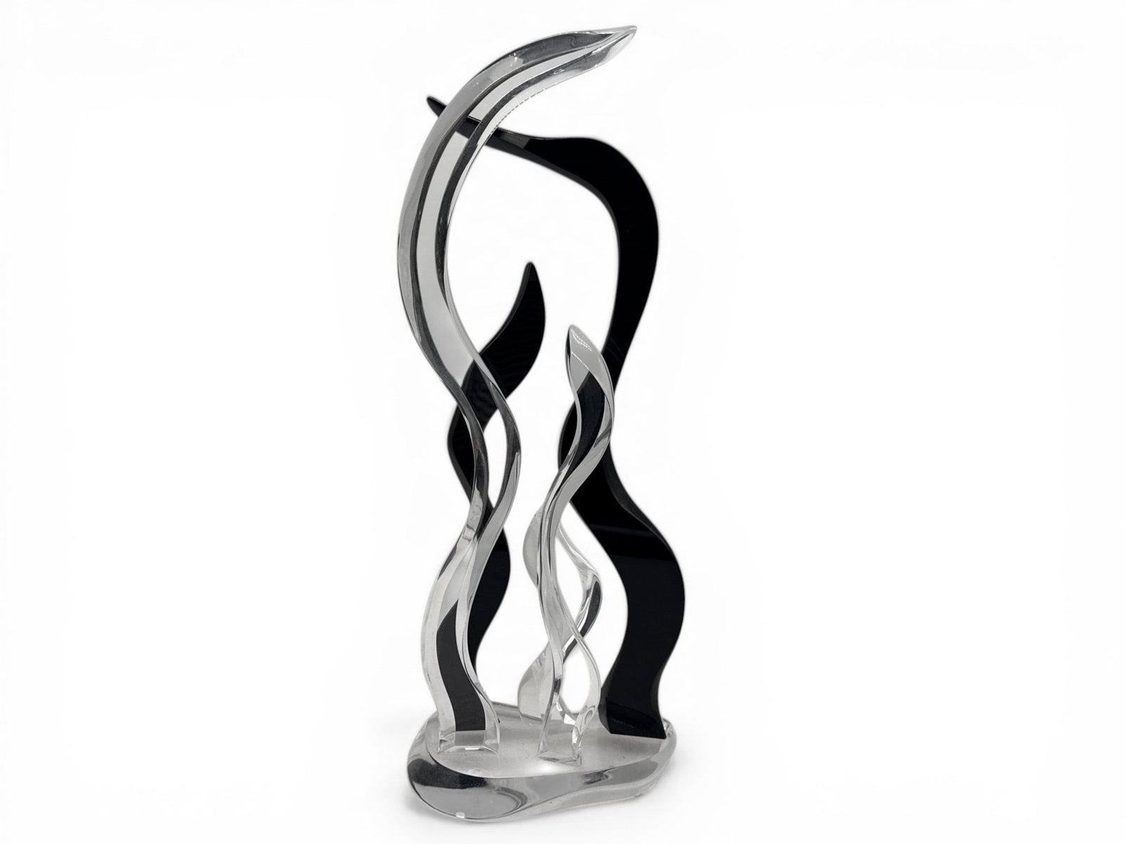 Lucy Phelps Acrylic Abstract Sculpture: Lucy Phelps (American, 20th C) An acrylic abstract sculpture with clear and black undulating waves. Signed. 23in tall x 9in wide. | You have additional shipping options, and are not required to use Li