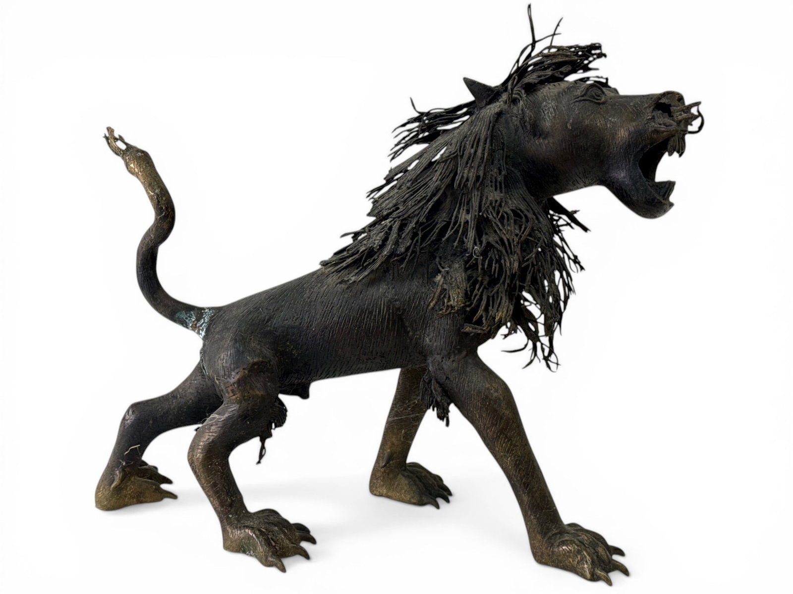 Bamileke Tribe Bronze Lion Sculpture: A Bamileke Tribe bronze sculpture of a roaring lion. 21in tall x 27in wide. | You have additional shipping options, and are not required to use Live Shipping. Additional third-party shipper details;