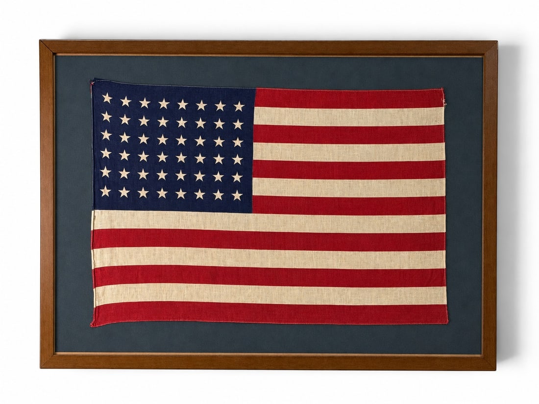 Framed 48-Star American Flag: A framed 48-star American flag. Sight of flag: 22in tall x 33-1/4in wide. Outside frame: 31-1/4 in x 43 in. | You have additional shipping options, and are not required to use Live Shipping. Additiona