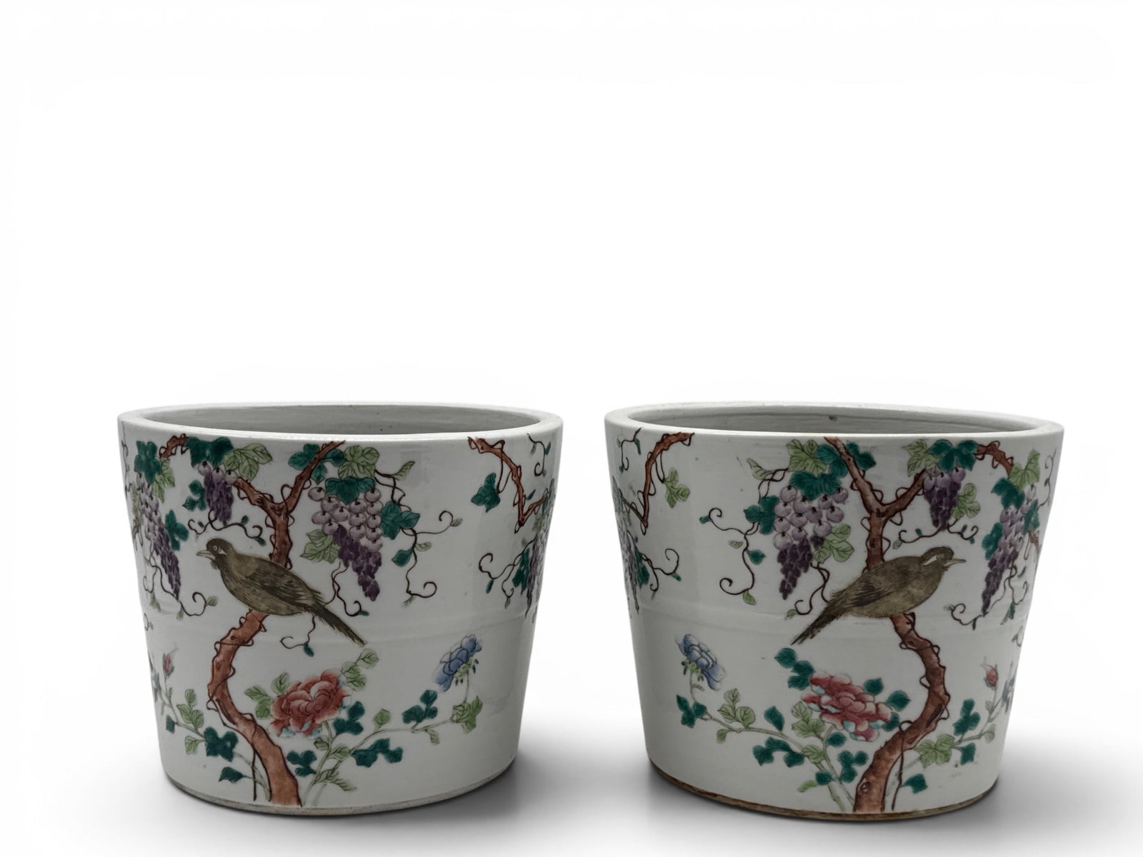 Pair of Chinese Famille Rose Porcelain Planters: A pair of Chinese famille rose porcelain cache pot planters with bird and grape leaf decoration. 6-1/2in tall x 8in wide. | You have additional shipping options, and are not required to use Live Shipp