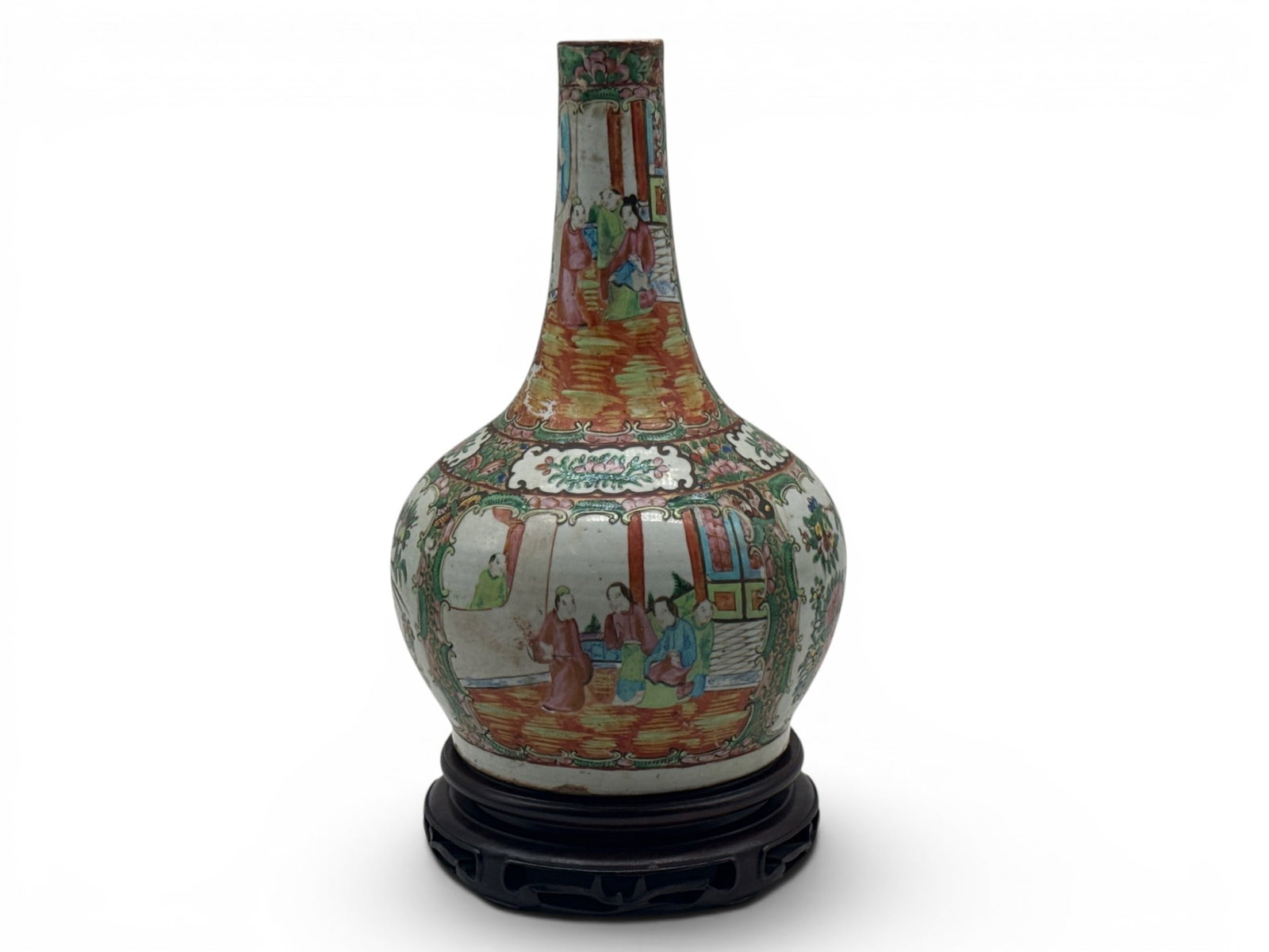 Chinese Export Rose Medallion Vase: A Chinese export rose medallion vase with genre scene surrounded by a botanical background, resting on a carved hardwood stand. Vase: 13in tall x 8in wide. | You have additional shipping options, and 