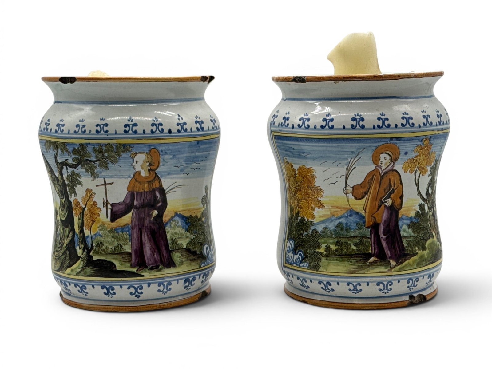 Two Italian Faience Albarello Apothecary Jars: A pair of 18th or 19th C. Italian faience Albarello apothecary jars with allegorical scenes. 9in tall x 7-1/4in wide. Filled with wax from candles. | You have additional shipping options, and are not 