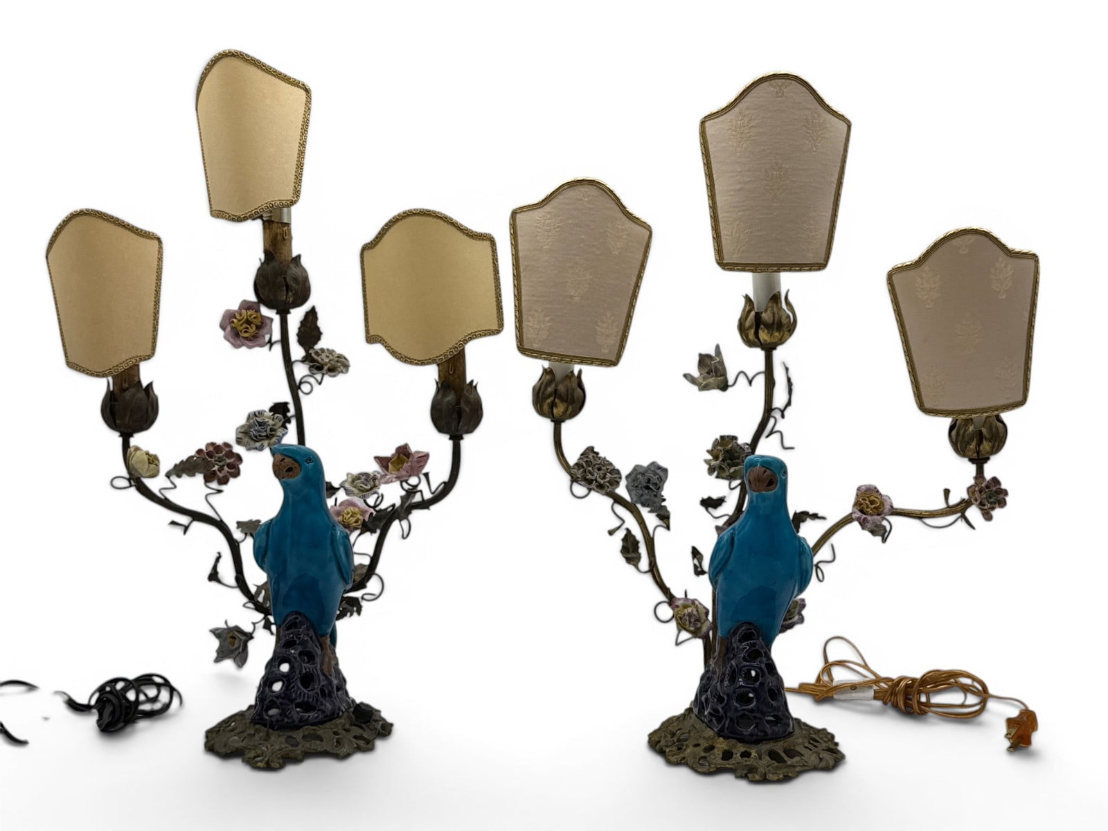 Pr. French Bronze and Porcelain Parrot Candelabra Lamps: A pair of French bronze, ormolu, and porcelain candelabras in the Rococo taste, with Chinese turquoise parrot figures on pierced bases, each with three foliate candle-arms decorated with porcelain flo