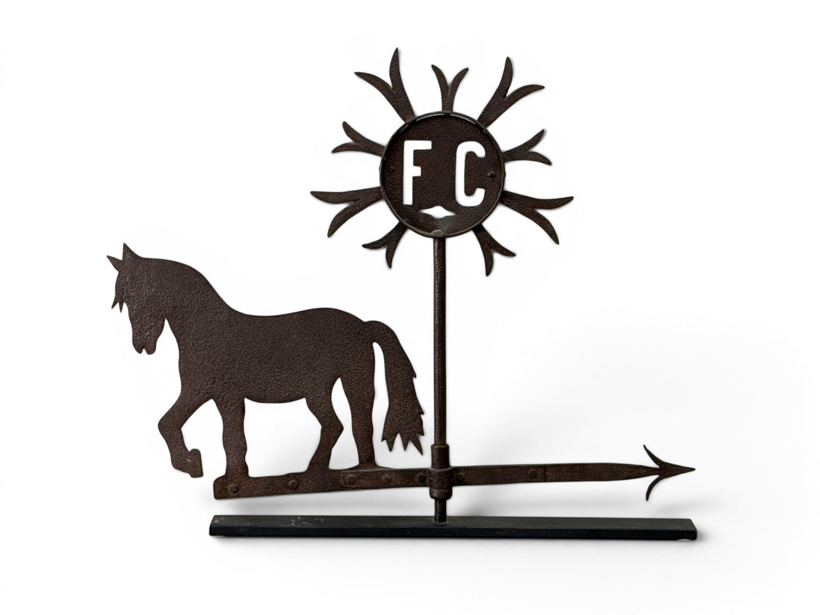 Sheet Iron Horse and Sunburst Weathervane: A 19th C. sheet iron figural weathervane depicting a horse on a directional arrow with sunburst having an "FC" monogram. Provenance: From a Main Line, PA private collection. 23in tall x 28in wide. | Y