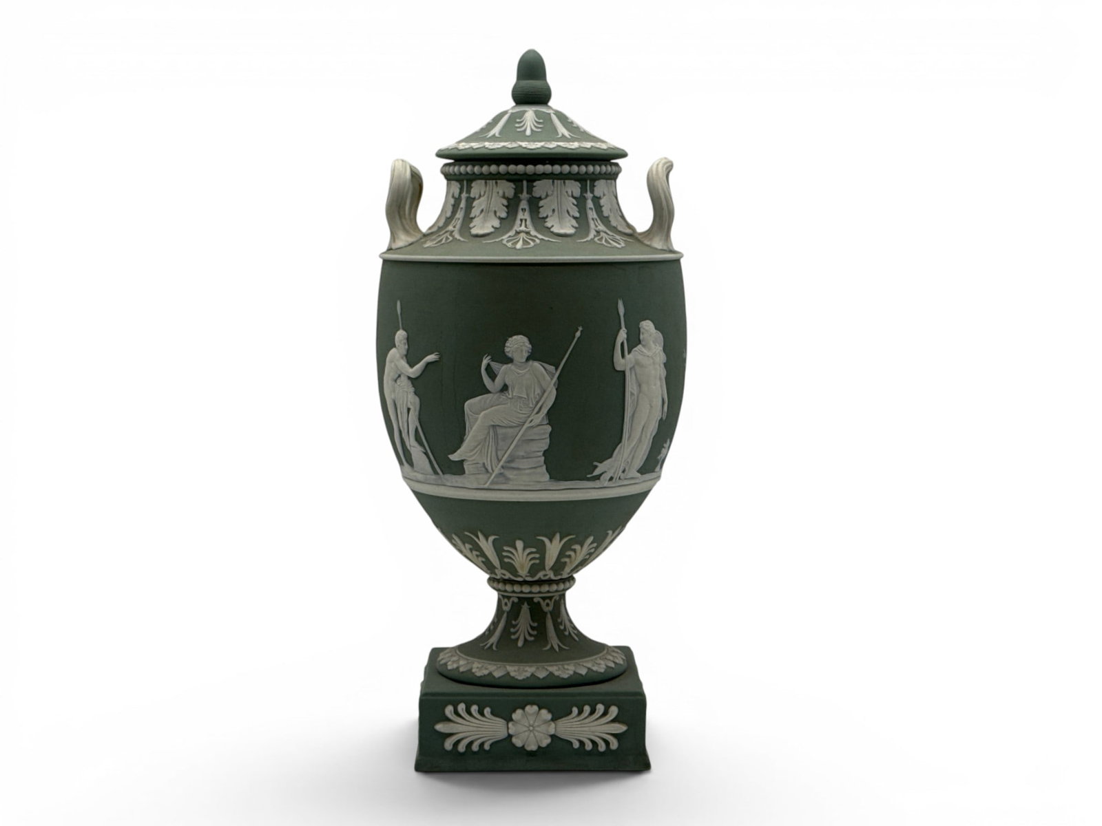 Wedgwood Sage Green Jasperware Covered Urn: A Wedgwood sage green jasperware urn with cover and relief classical designs. 15-1/2in tall x 7in wide. | You have additional shipping options, and are not required to use Live Shipping. Additional sh
