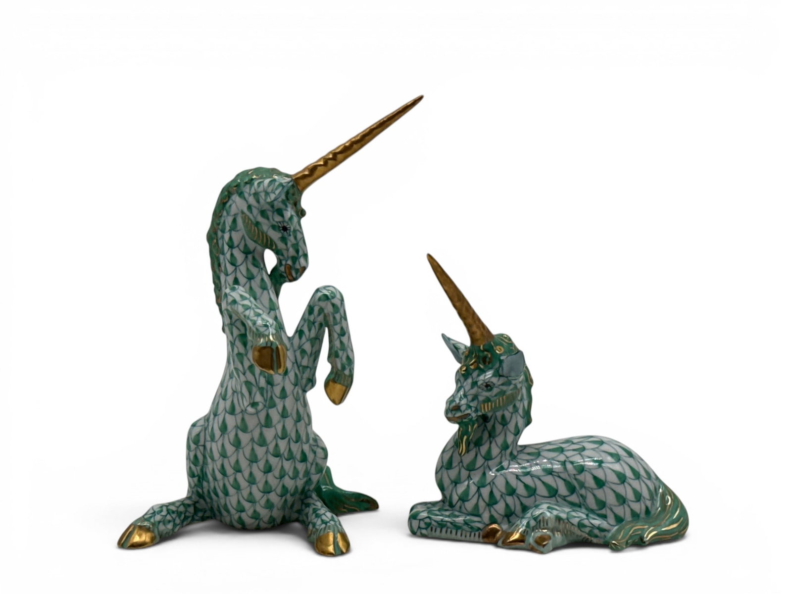 Two Herend Porcelain Unicorns: A pair of Herend of Hungary porcelain unicorn figurines in the green fishnet pattern. Marked Herend. 5in tall x 2in wide. | You have additional shipping options, and are not required to use Live Shipp