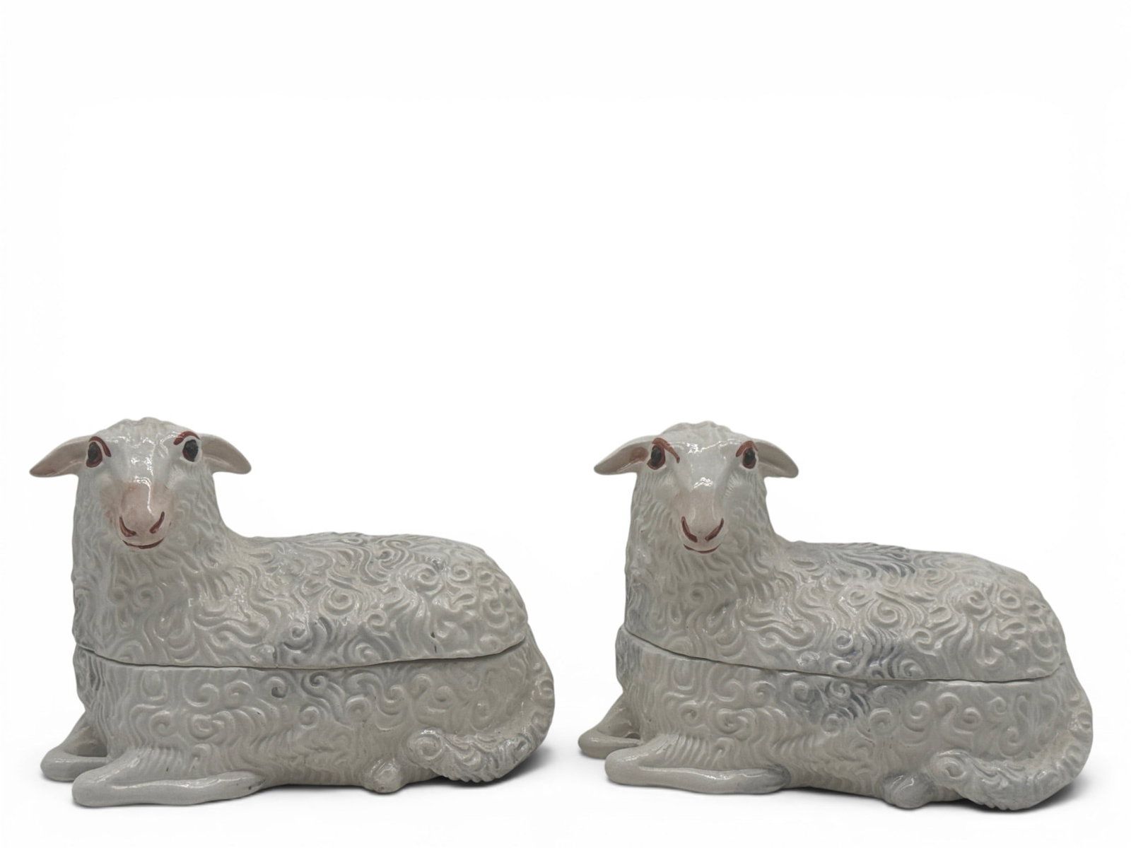 Two Mottahedeh Figural Sheep Covered Dishes: A pair of Mottehedeh, porcelain covered dishes in the form of sheep. Signed. 4-1/2in tall x 6in wide. | You have additional shipping options, and are not required to use Live Shipping. Additional ship