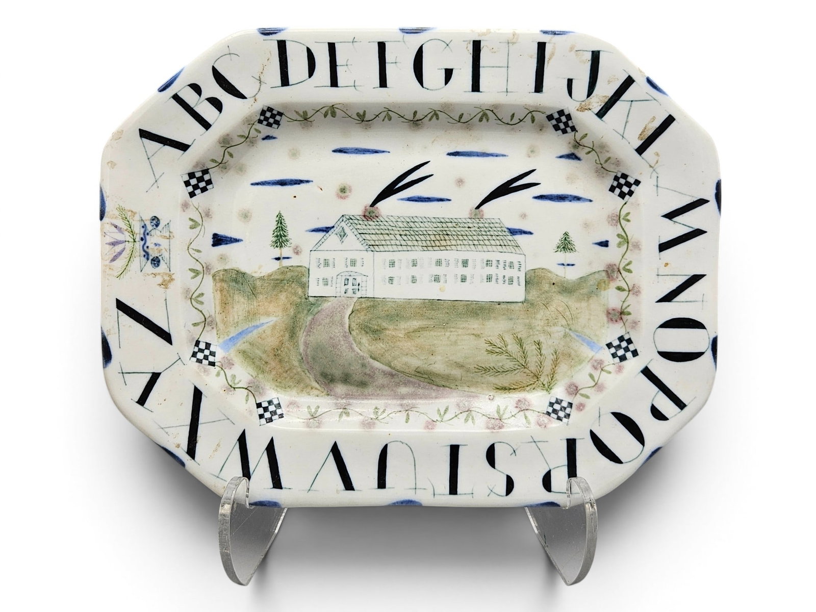 Mara Superior Porcelain Alphabet Platter: A Mara Superior glazed and underglazed porcelain platter with a folk art decorated scene surrounded by alphabet text. 7-1/4in x 9-1/2in. | You have additional shipping options, and are not required to