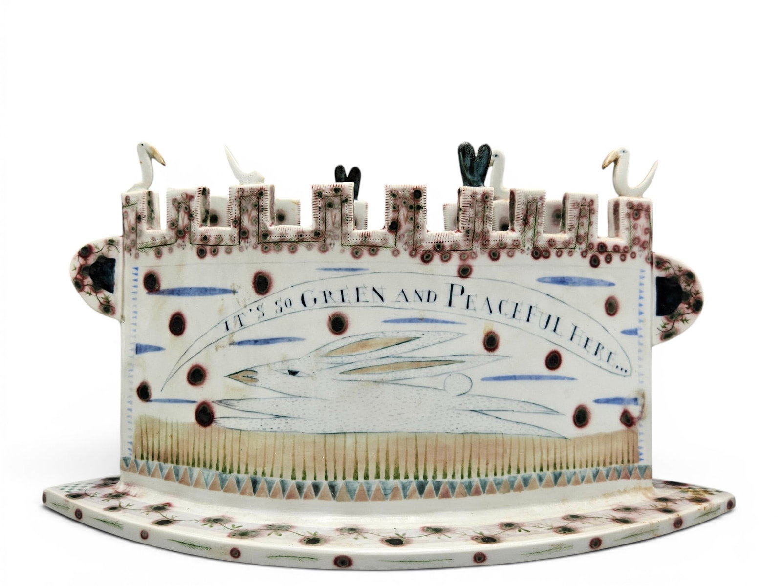 Mara Superior Porcelain Sculpture: Green and Peaceful: Mara Superior glazed and underglazed sculpture of castle form titled "It's So Green and Peaceful Here" with folk art rabbit decoration, applied bird figures, and floral border. | You have additional s