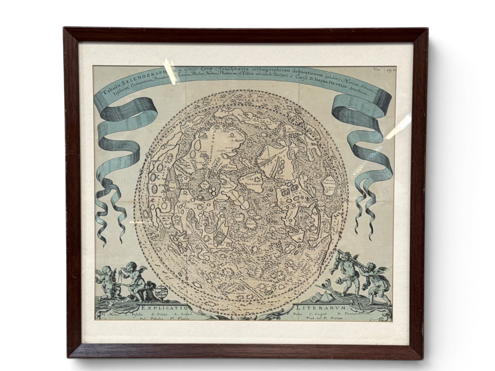After Johanne Hevelius Selenographia Map: A Selenographia map after Johannes Hevelius with cherubs flanking a large model of the globe. Frame: 18in x 19-1/2in. | You have additional shipping options, and are not required to use Live Shipping.