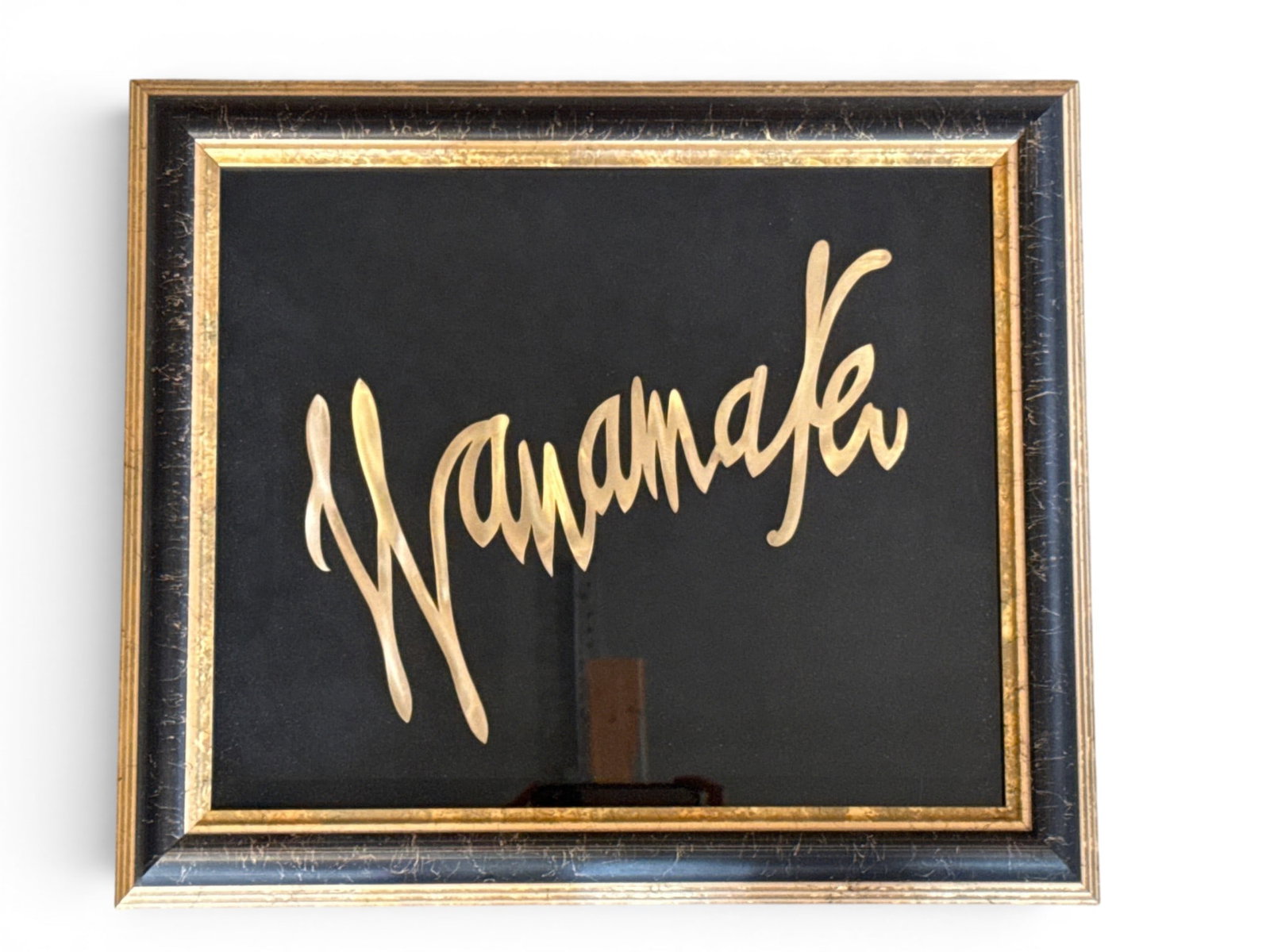 Framed John Wanamaker Sign: A framed "Wanamaker" sign in script 17in tall x 20in wide. | You have additional shipping options, and are not required to use Live Shipping. Additional shipping and delivery details are available on