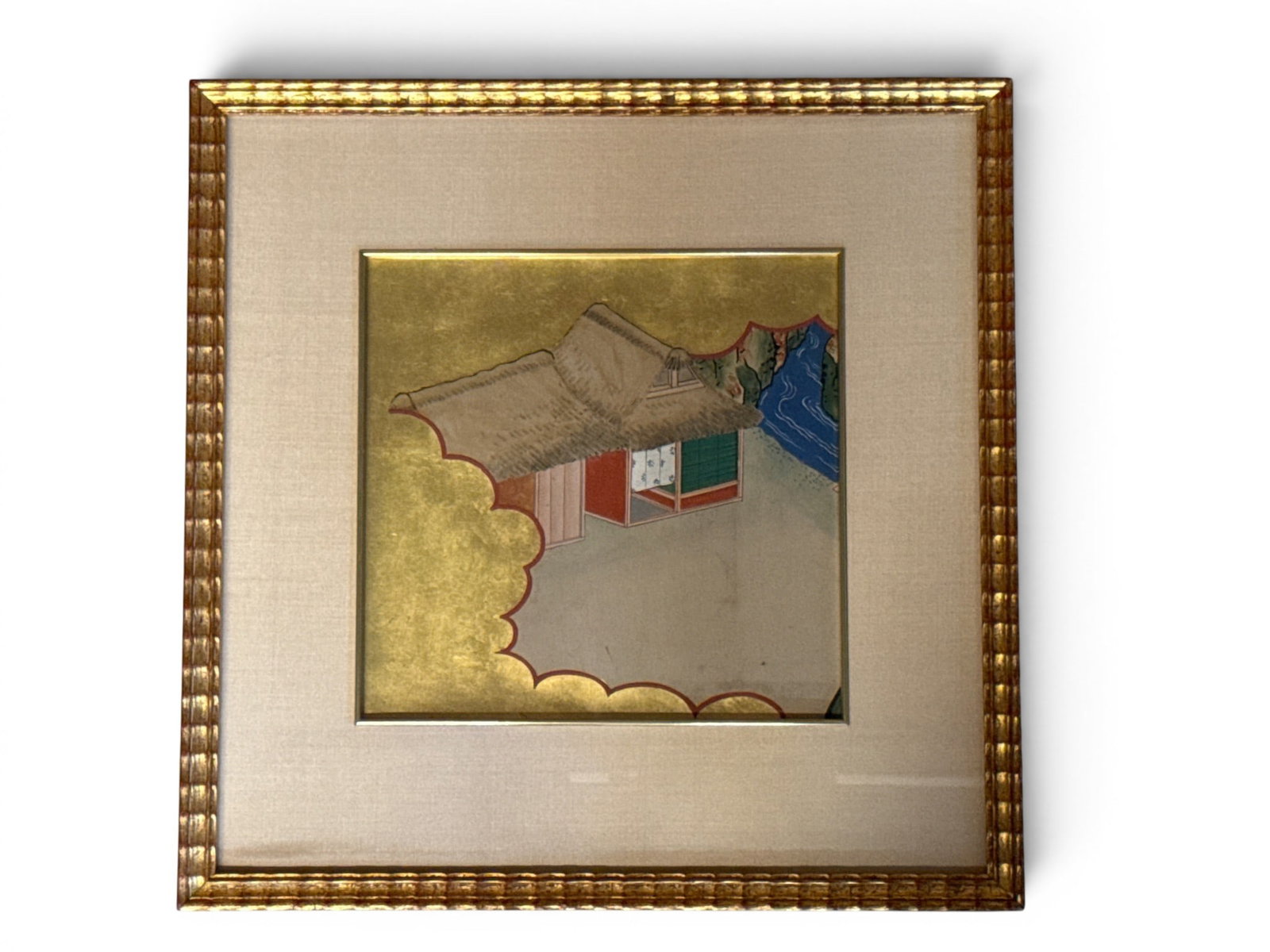 Japanese Gouache/Paper: House: A gilt-framed Japanese gouache on paper of a thatched roof house surrounded by gilt decoration. Mat opening: 9-1/2in x 10in. Frame: 17in x 17in. | You have additional shipping options, and are not