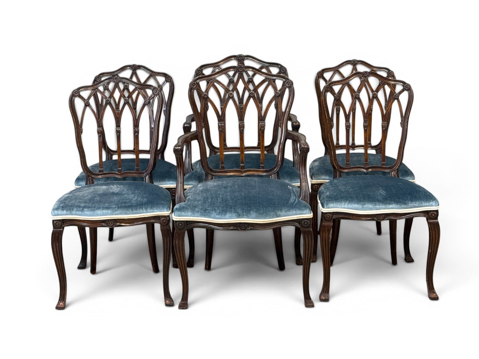 Six Louis XV-style Carved Mahogany Dining Chairs: A set of six Louis XV-style carved mahogany dining chairs with floral medallion and woven backs, on cabriole legs. Armchairs: 37in tall x 21-1/2in wide x 19in deep. | You have additional shipping