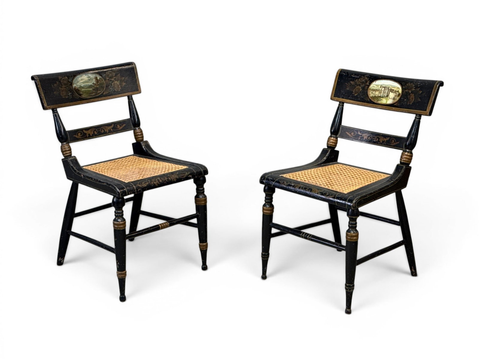 Pair of Baltimore Classical Painted Fancy Chairs: A pair of Baltimore Classical painted "Fancy" side chairs with landscape backs and caned seats. 30-1/2in tall x 17in wide x 20in deep. | You have additional shipping options, and are not required to