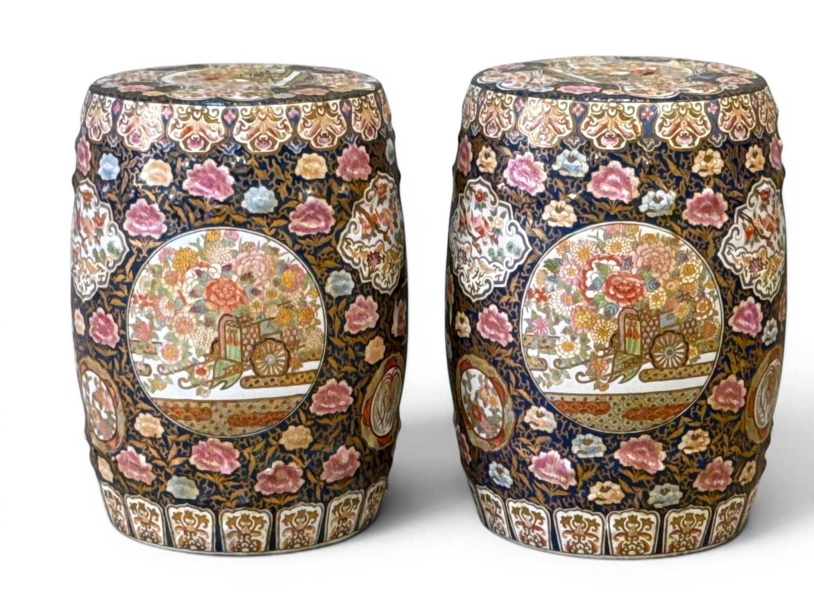Pair of Chinese Porcelain Garden Seat Stools: A pair of highly-decorated Chinese porcelain garden seat stools with pierced sides. Each: 18in tall x 12in wide. | You have additional shipping options, and are not required to use Live Shipping.