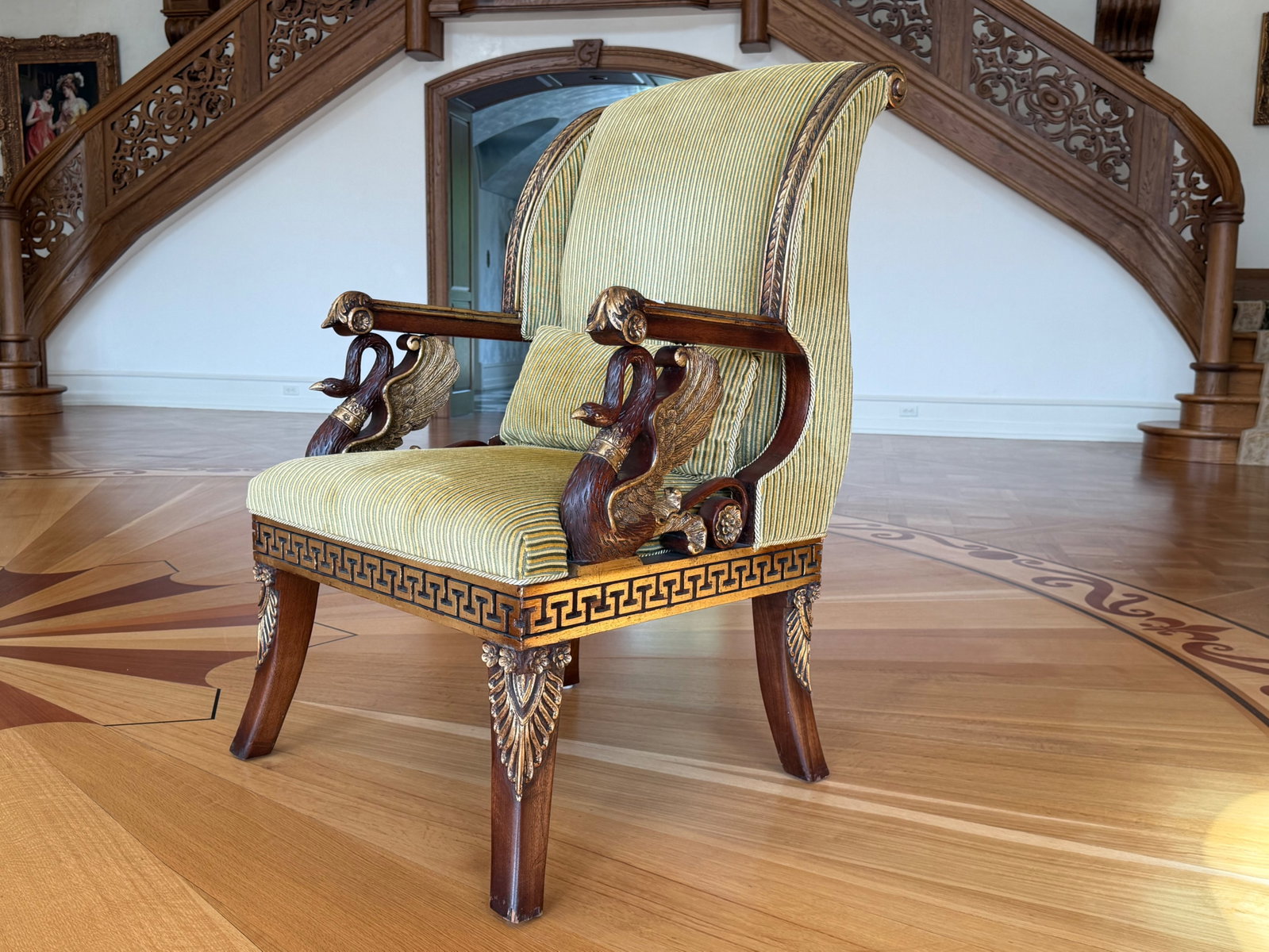 Egyptian Revival Swan Carved Hall Chair: An Egyptian Revival gilt-adorned swan-carved hall chair with striped upholstery. 43in tall x 27in wide x 26in deep. | You have additional shipping options, and are not required to use Live Shipping. A