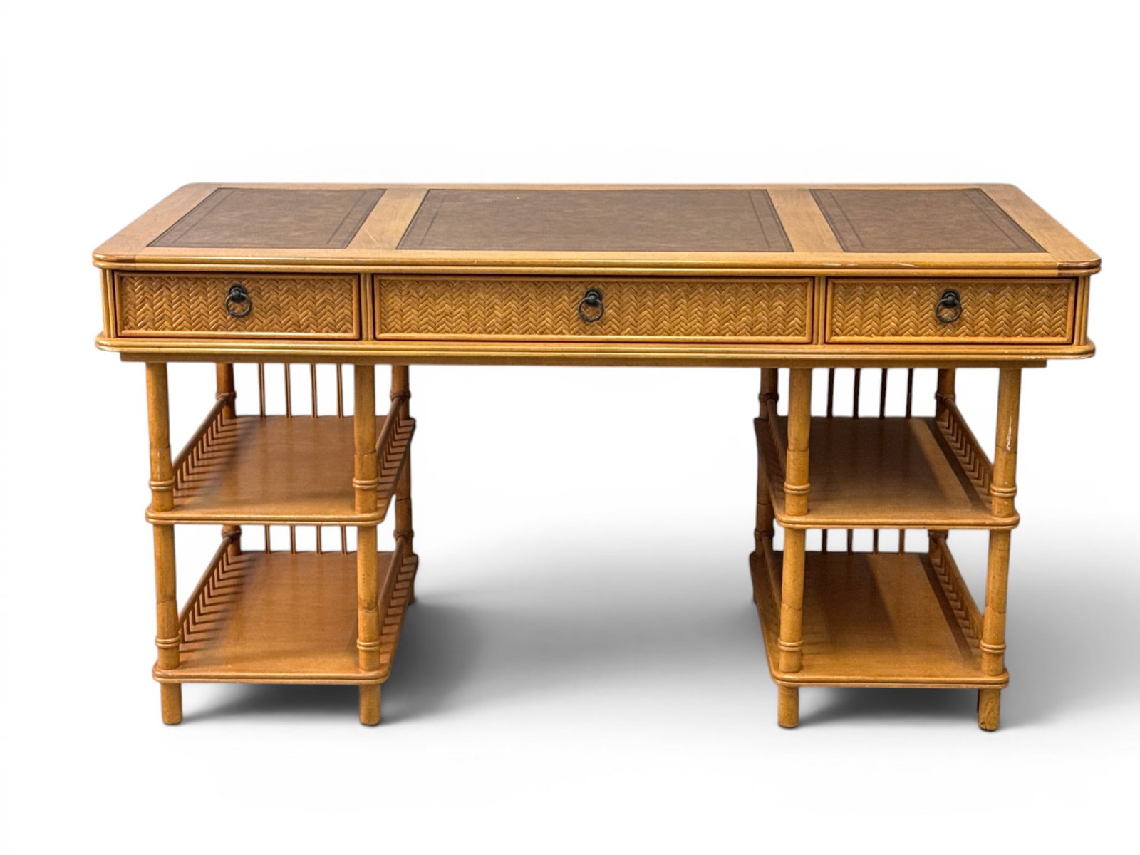 Attrib. Tommy Bahama Bamboo and Rattan Desk: An attributed to Tommy Bahama Home bamboo and rattan campaign-style desk with a triple leather top over a double-pedestal open shelf base. 31in tall x 60in wide x 30in deep. | You have additional