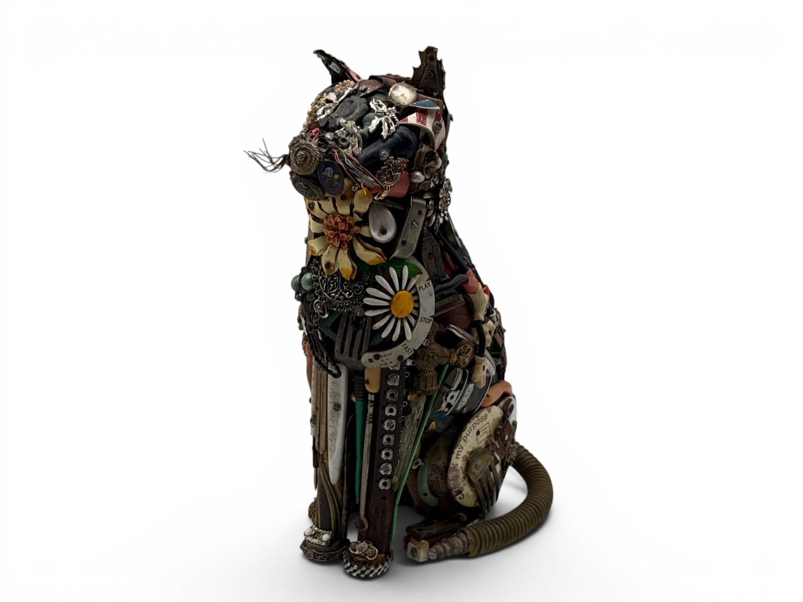 Leo Sewell Found Object Sculpture: Seated Cat: Leo Sewell (b. 1945). A found object sculpture of a seated cat comprised of costume jewelry, pins, wires and household objects. Signed and dated 1984. 14in tall x 9in wide. | You have additional