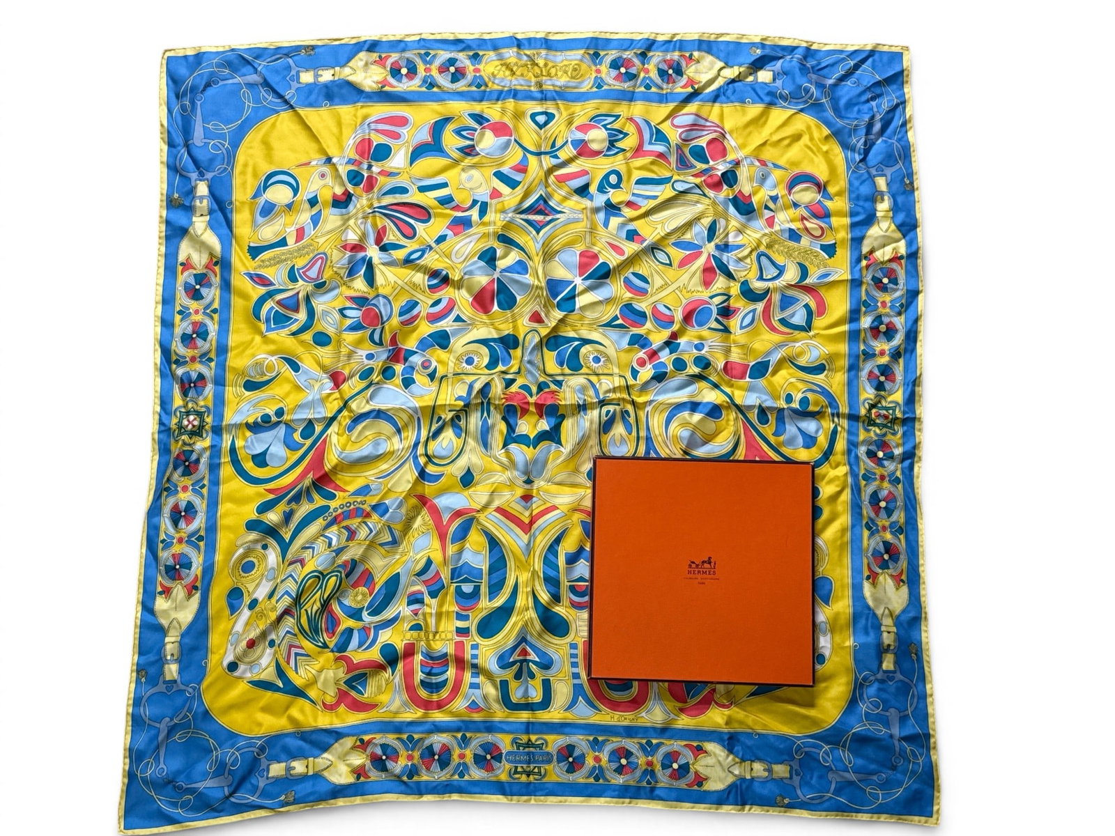 Hermes Paris Folklore Silk Scarf: An Hermes Paris Folklore silk scarf with stylized bird and belt decoration. Includes Hermes gift box. 34-1/2in tall x 34in wide. | You have additional shipping options, and are not required to use Liv
