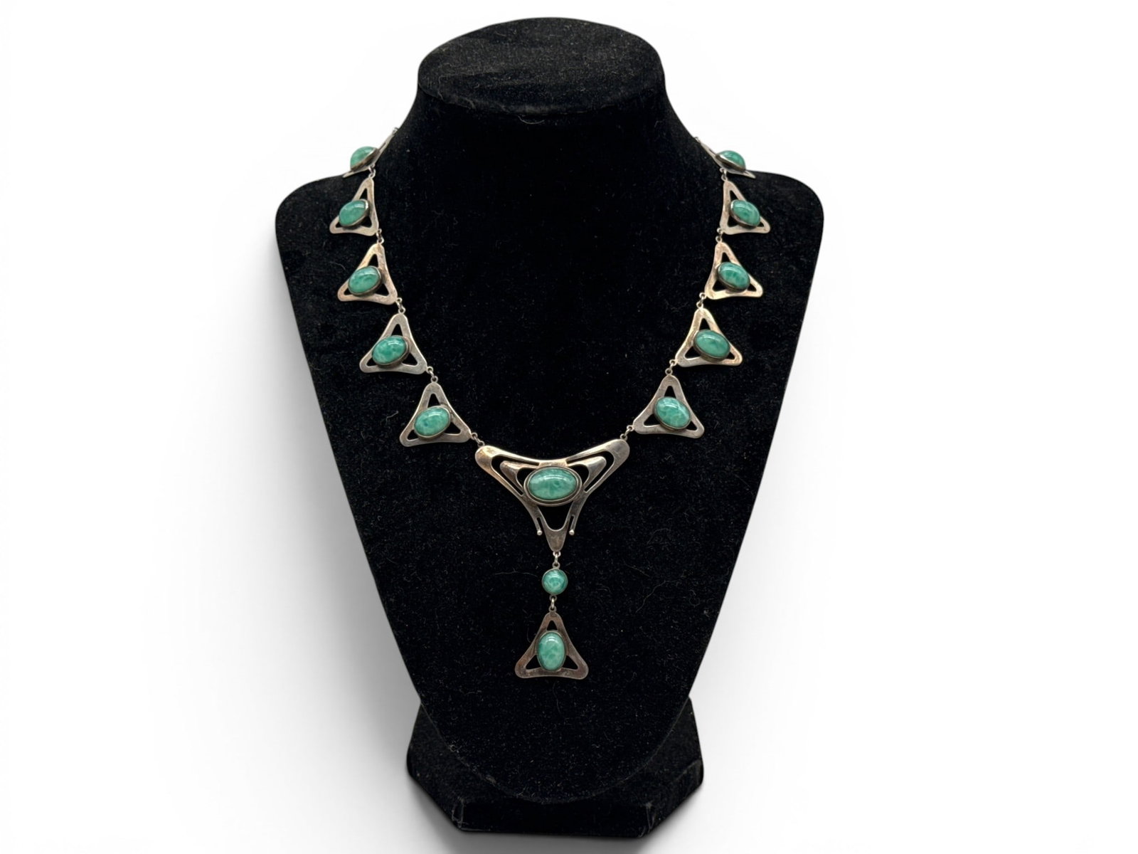 Art Nouveau Sterling Silver Cabochon Pendant Necklace: An Art Nouveau sterling silver pendant with triangular links and green cabochon stones. Marked "Sterling" on clasp. 16in long. 21.4 dwt. | You have additional shipping options, and are not required to