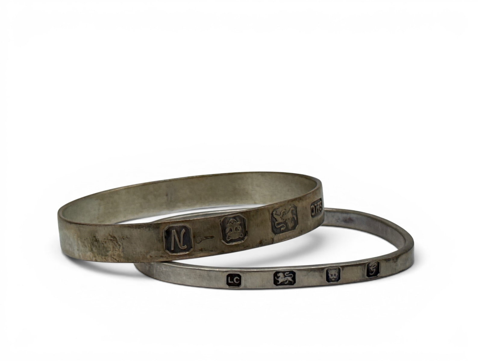 Two English Hallmarked Sterling Silver Bangles: A pair of English hallmarked sterling silver bangle bracelets. Larger: 3in wide. 1.56 ozt. | You have additional shipping options, and are not required to use Live Shipping. Additional shipping and de