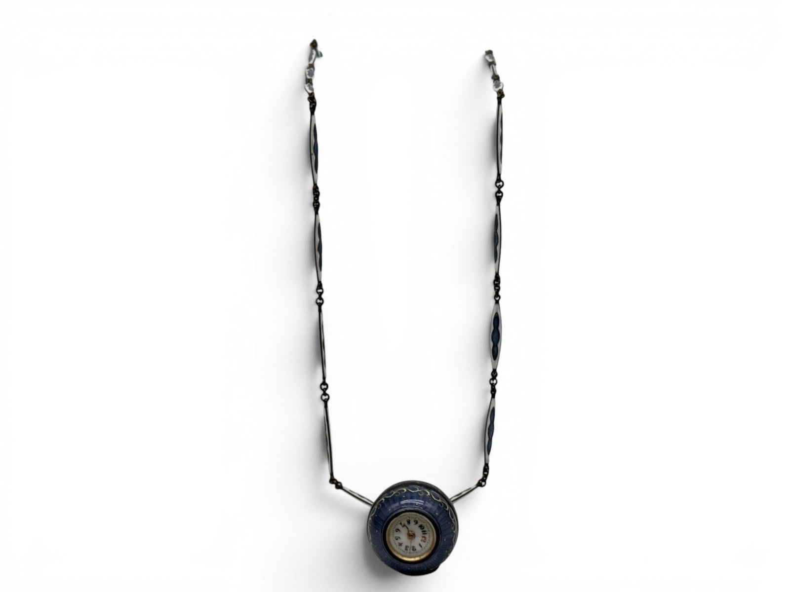Boule de Geneve Guilloche Enamel Necklace: A Boule de Geneve guilloche enamel necklace with cobalt blue enameled clock face pendant surrounded by gilt decoration. 21in long. | You have additional shipping options, and are not required to use