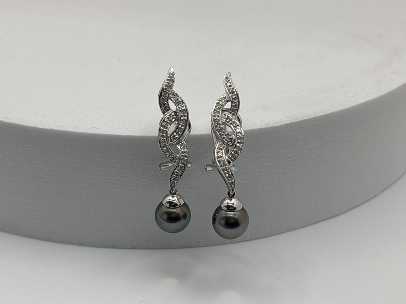 14K Pave Diamond Tahitian Pearl Drop Earrings: A pair of 14K white gold pierced earrings with pav? diamonds and suspended Tahitian pearls of 8.4mm. Stamped 585/14K and "JPS". 1-5/8in long overall. 4.45 dwt. | You have additional shipping options, 
