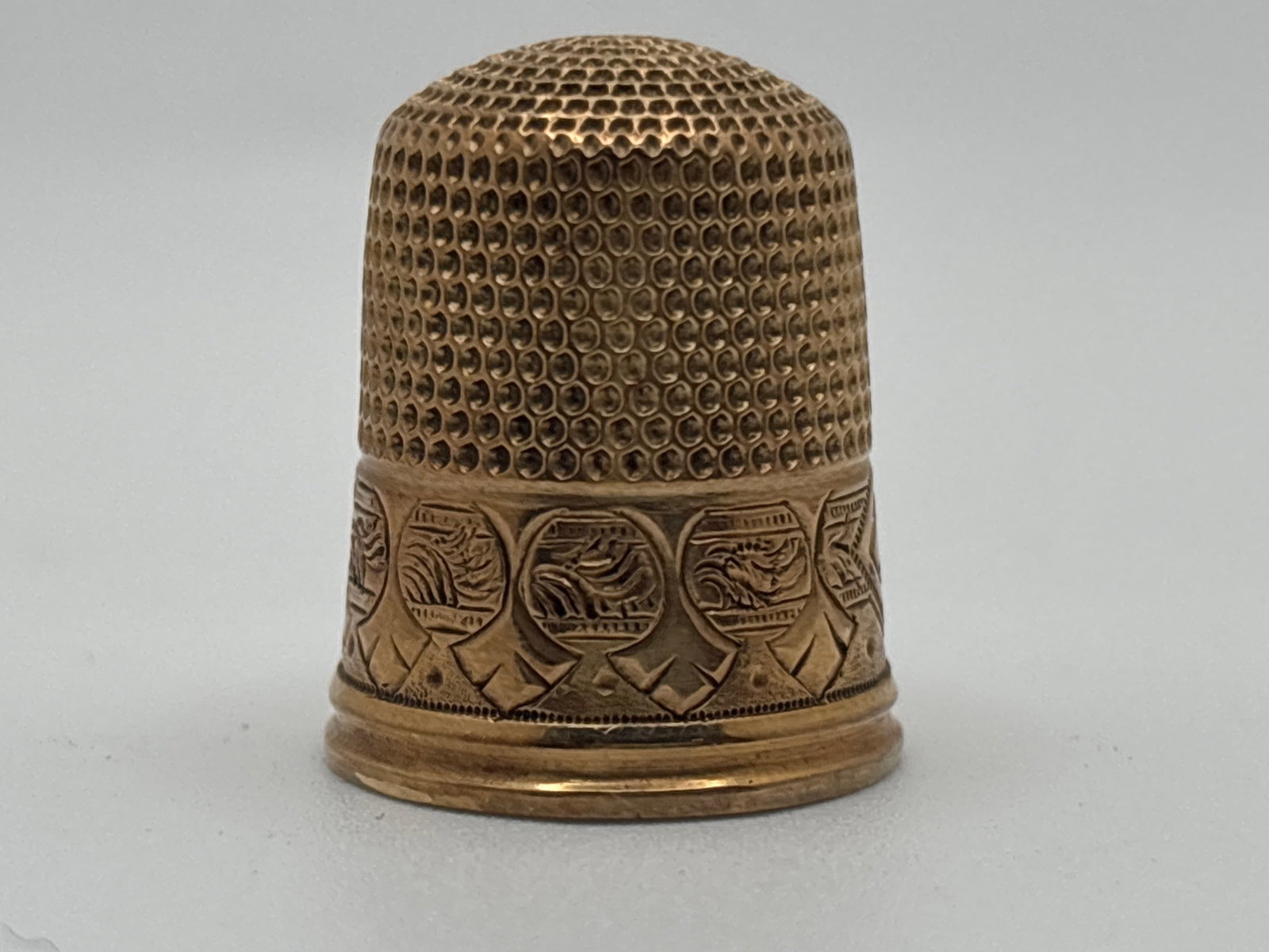 14K Chased and Pattern-Decorated Thimble: A 14K yellow gold thimble with three-letter monogram, dated 1893. 3/4in tall. 2.35 dwt. | You have additional shipping options, and are not required to use Live Shipping. Additional shipping and