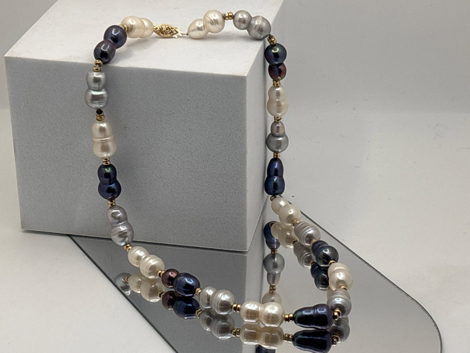 Baroque Pearl Multi-Color Statement Necklace: A tri-color 16mm x 9.7mm baroque pearl statement necklace, interspersed with gold spacers. Stamped possibly "TPS" and 585 at filigree closure. 17in long. | You have additional shipping options, and
