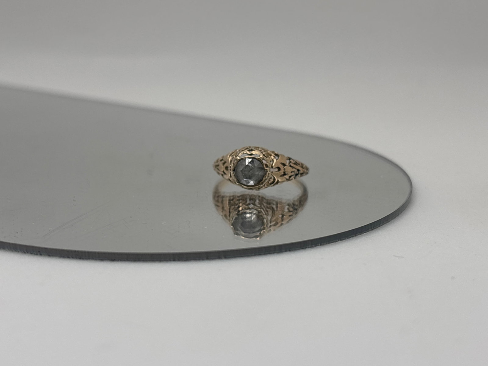 Rose Cut Diamond Filigree Ring: A 10K gold (tested) filigree engagement ring with a 5.4mm x 4.7 mm rose cut diamond, possibly foil backed. Ring size 5.75. 1.02 dwt. | You have additional shipping options, and are not required to use