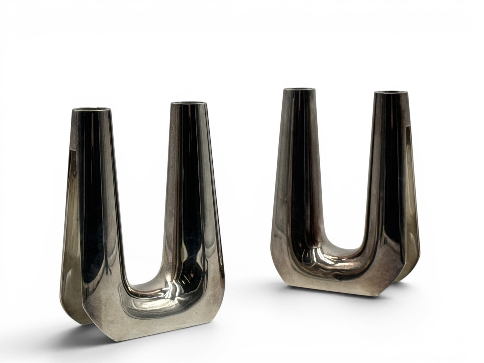 Soren Georg Jensen Model 1087 Sterling Candlesticks: Soren Georg Jensen (Denmark, 1917-1982) A pair of sterling silver four-light candlesticks of model number 1087 with U-shaped form. Circa 1960. 7in tall x 5in wide. 48.39 ozt. | You have additional