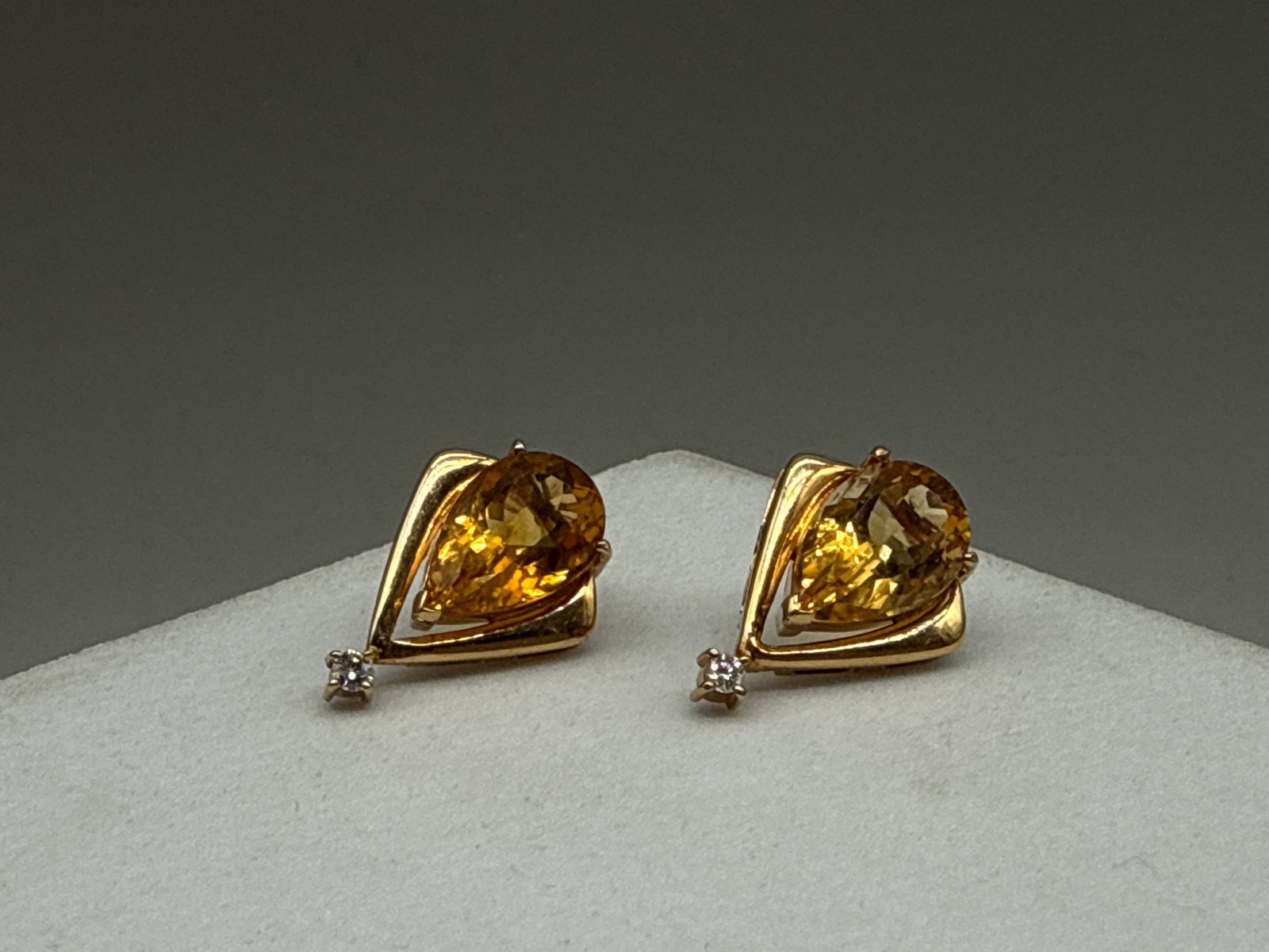14K Citrine and Diamond Earrings: A pair of 14K yellow gold earrings with pear cut citrines accented with small diamonds. Tests as 14K. 3/4in tall. 4.62 dwt. | You have additional shipping options, and are not required to use Live Shi