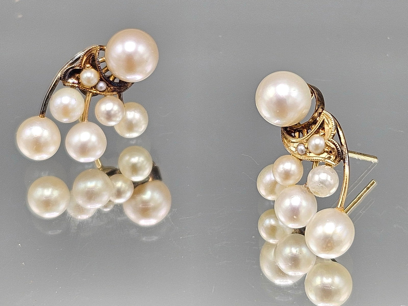 14K Pearl Cluster Earrings: A pair of 14K yellow gold earrings each with eight clustered pearls. 3/4in tall. 2.50 dwt. | You have additional shipping options, and are not required to use Live Shipping. Additional shipping and de