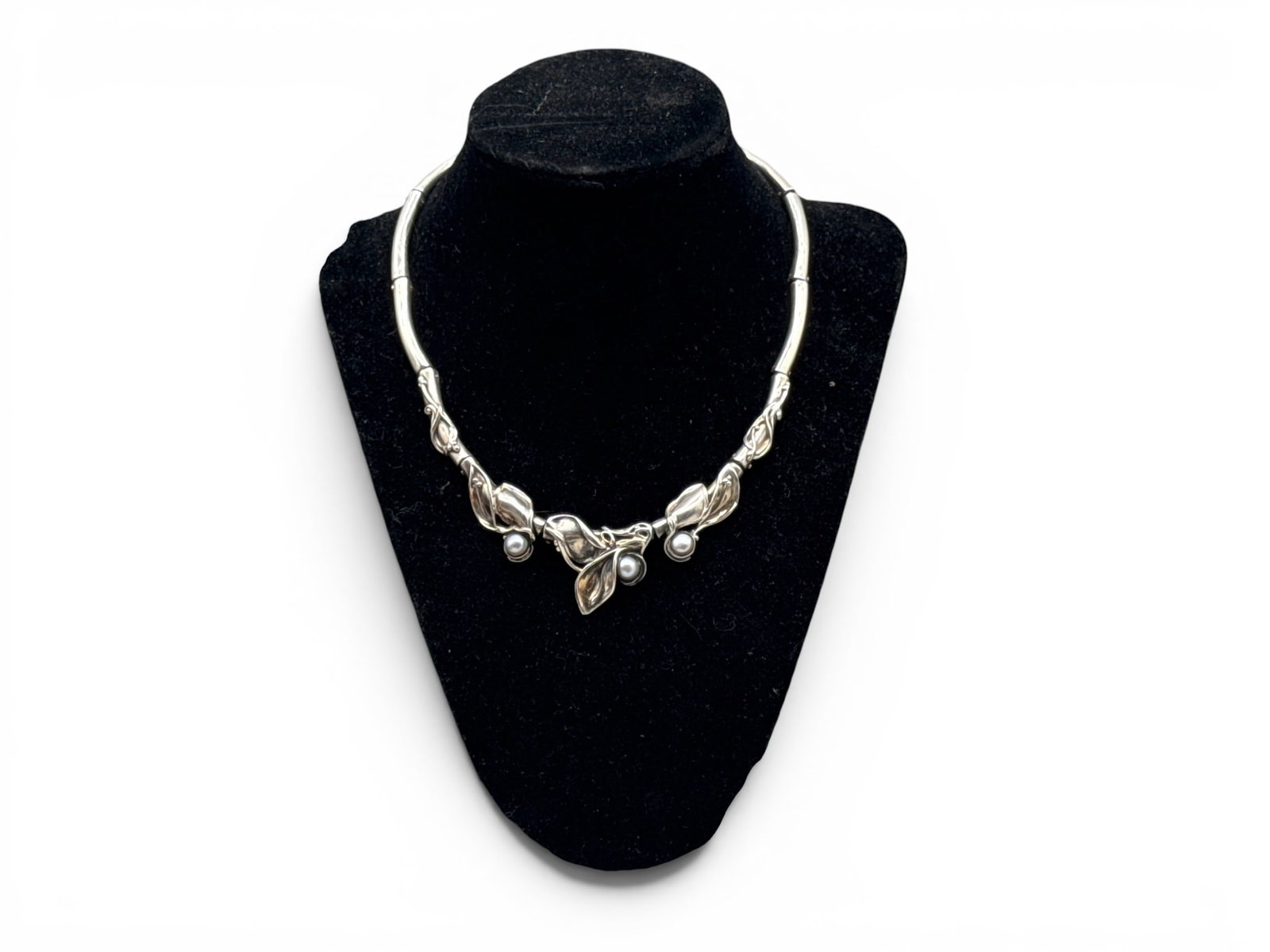 Hagit Gorali Sterling and Pearl Necklace: A Hagit Gorali sterling silver collar necklace with stylized cala lily motif and three small pearls. Signed. 12in long. 30.86 dwt. | You have additional shipping options, and are not required to use L