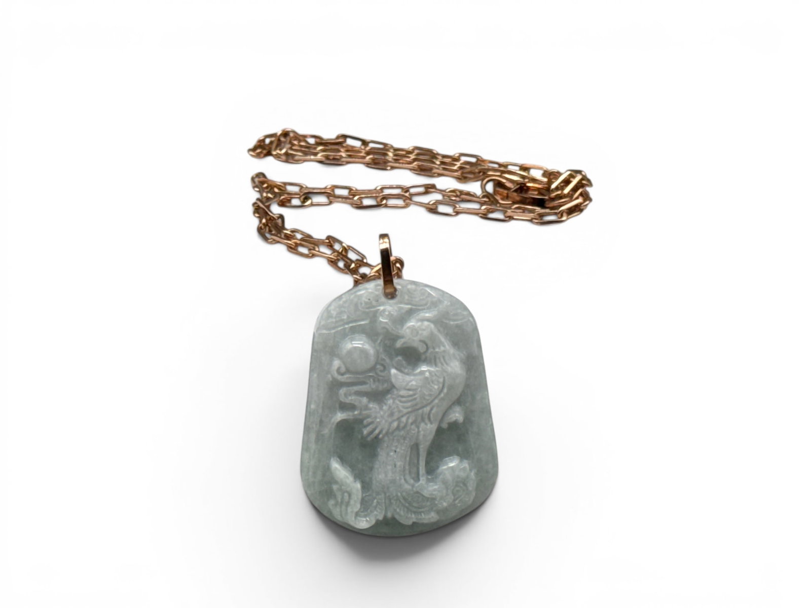14K and Carved Jade Phoenix Necklace: A carved jade pendant with phoenix relief attached to a 14K yellow gold chain. Chain is marked 585. 28in long. 25.01 dwt. | You have additional shipping options, and are not required to use Live Shipp