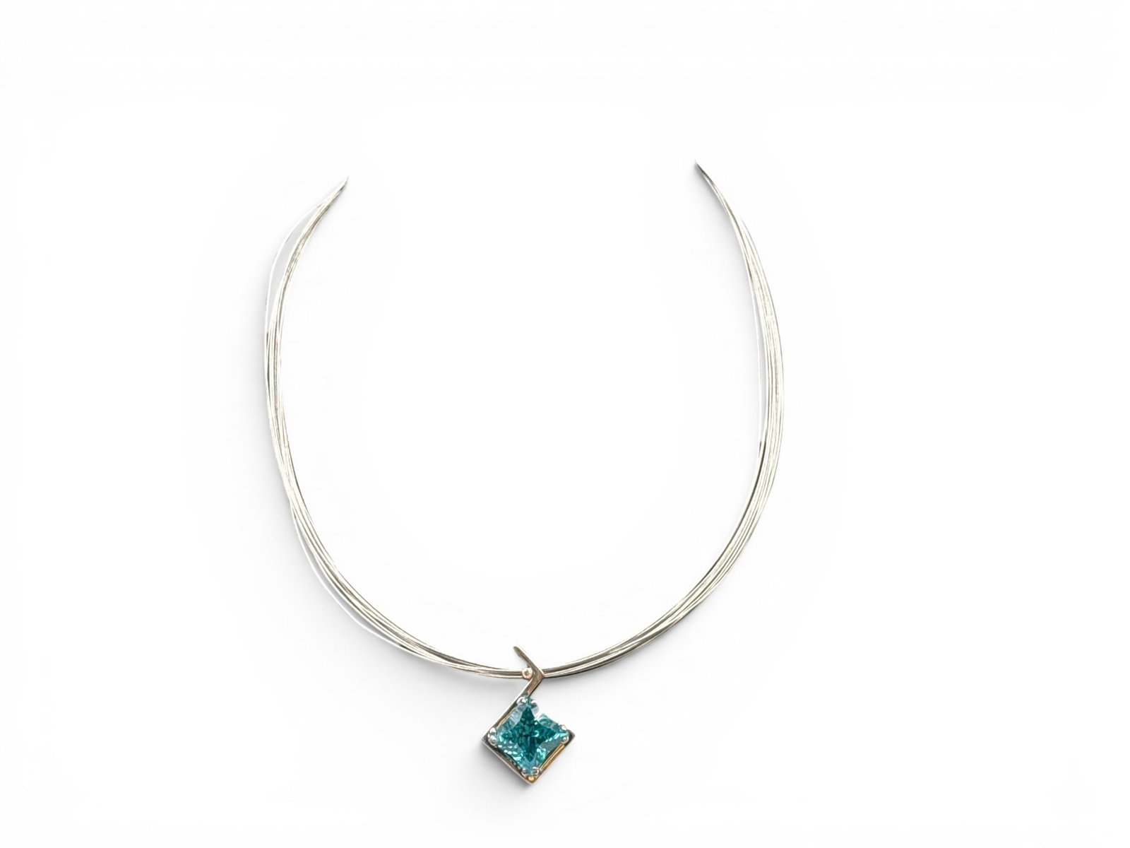 Frank Reubel Topaz and Diamond Necklace: A Frank Reubel sterling silver multi-strand wire collar necklace with a faceted blue topaz and small diamond in a modernist pendant setting. Marked 925. 14in long. 6.43 dwt. | You have additional ship