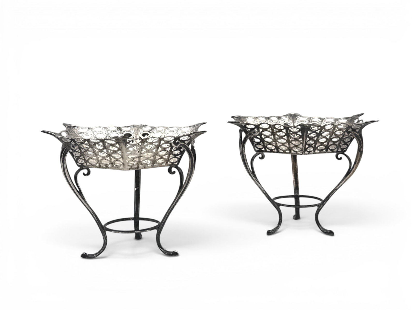Edwardian Sterling Footed Candy Dishes: A pair of English Edwardian sterling candy dishes with reticulated basket bodies terminating on stylized feet. 3-3/4in tall x 5-1/2in wide. 7.92 ozt. | You have additional shipping options, and are no
