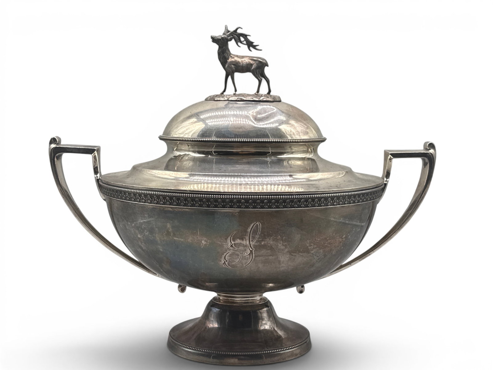 Ball, Black & Co. Sterling Soup Tureen: A Ball, Black, & Co. sterling silver-handled soup tureen of oval footed form with a domed lid surmounted by stag forms, a fleur-de-lis border, prominent curved handles and beaded foot. Marked Ball, Bl