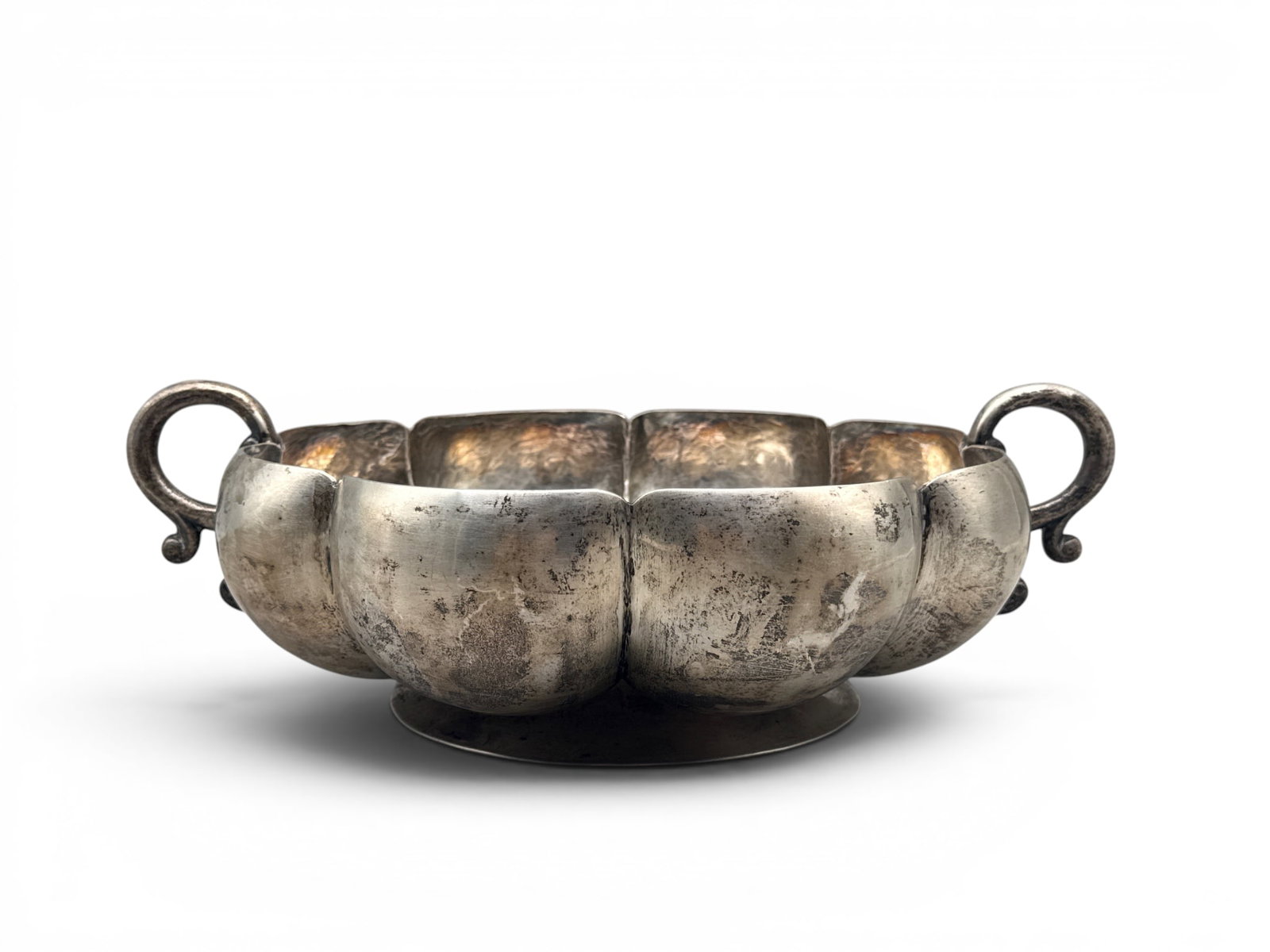 Maciel Sterling Silver Art Deco Centerpiece Bowl: A Maciel Silver Co. Art Deco hammered sterling silver centerpiece bowl of melon ribbed form with scrolled handles. Impressed Maciel Mexico Sterling on base. 4in tall x 14in wide. 41.1 ozt. | You have 