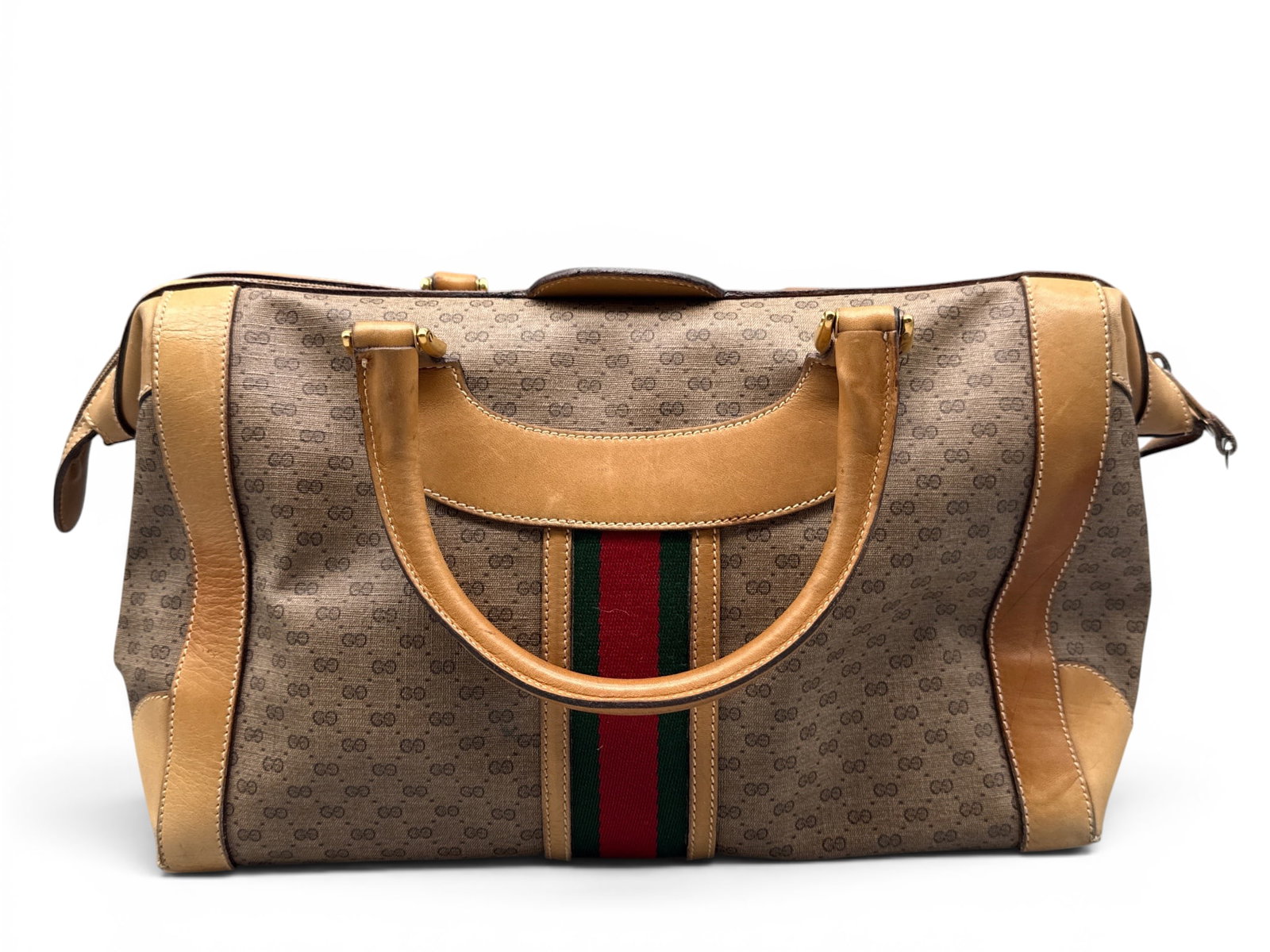 1970s Gucci Monogram Boston Bag: A Gucci Boston monogram handbag with Sherry Line stripe. Marked Gucci on interior with serial number 002-103-0511. 9in tall x 14in wide. | You have additional shipping options, and are not required to