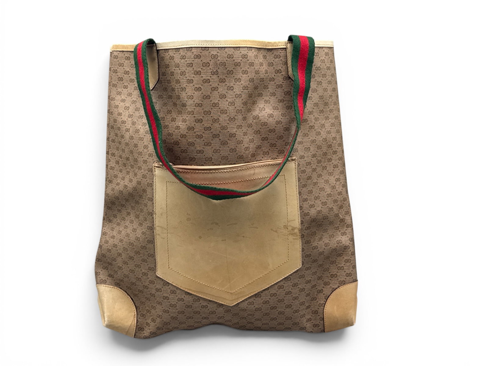 Gucci Monogram Canvas Tote: A Gucci monogram tote with leather accent pocket and green and red Sherry Line canvas handles. Marked Gucci on interior. 15in tall x 10in wide. | You have additional shipping options, and are not requ