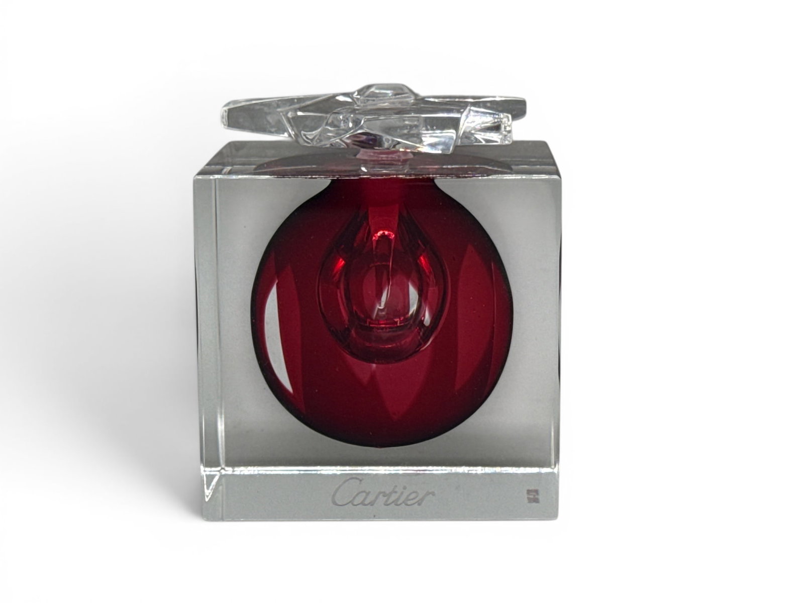Cartier Delices Perfume Bottle: A limited-edition Cartier Delices art glass perfume bottle of cubic form with floral stopper. Signed Cartier. Numbered 21/380. 3-1/4in tall x 3in wide. | You have additional shipping options, and are 