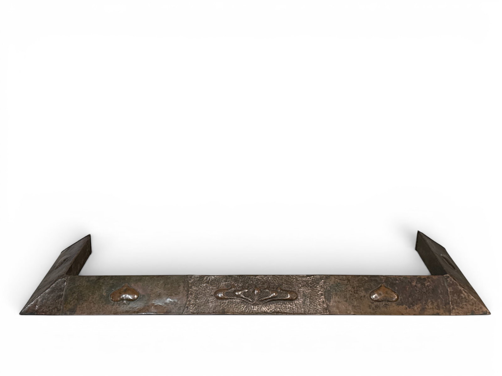 Arts & Crafts Hammered Copper Fireplace Fender: An Arts & Crafts fireplace fender in wood-wrapped and hammered copper frame, decorated with a stylized botanical design. 3in tall x 56in wide. | You have additional shipping options, and are not requi