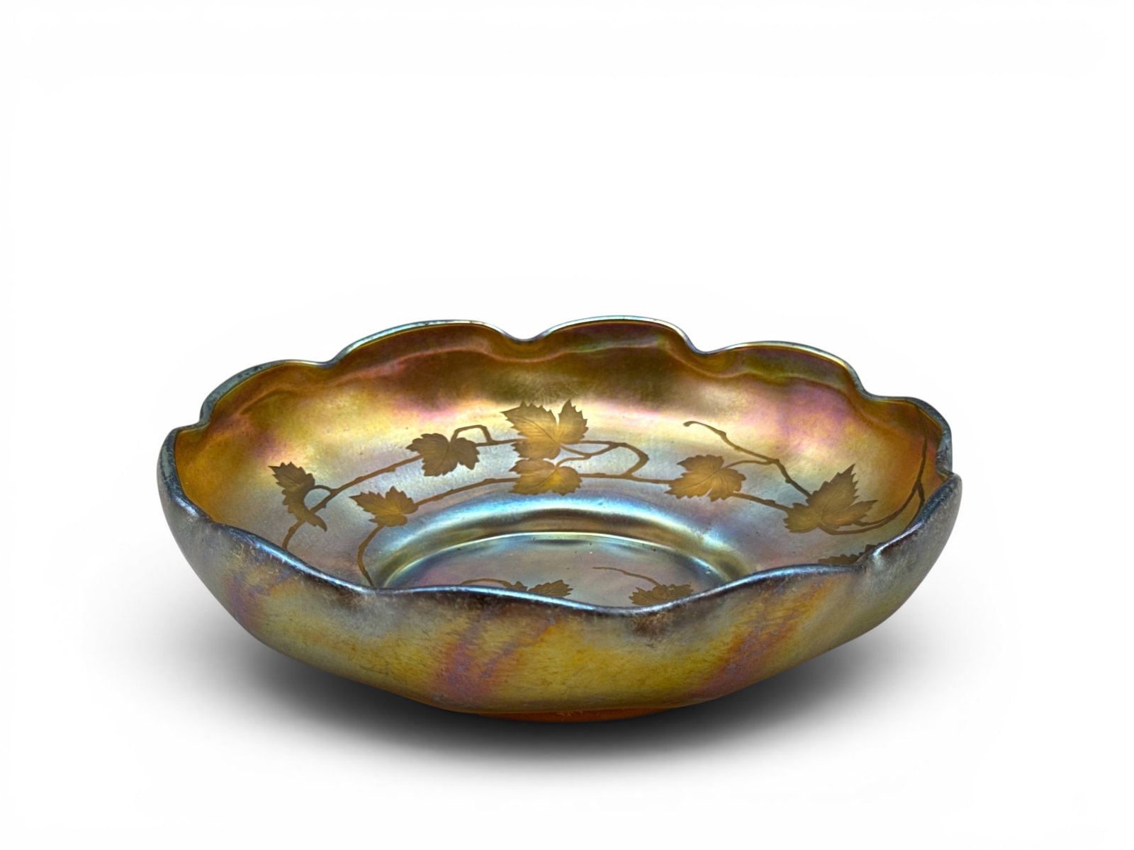 Louis Comfort Tiffany Favrile Grapevine Bowl: A Louis Comfort Tiffany iridescent favrile glass bowl with scalloped-edge rim and etched grape leaf design. Signed. 3in tall x 8in wide. | You have additional shipping options, and are not required to