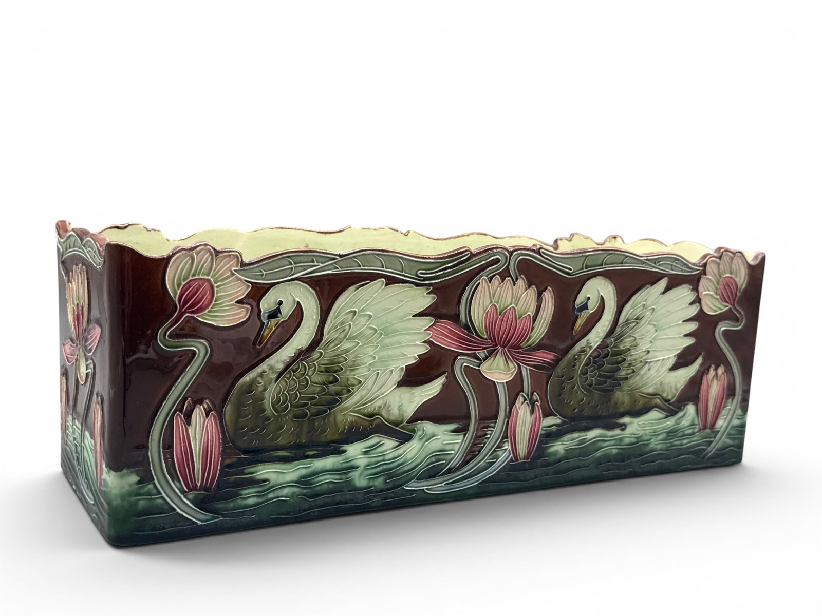 Julius Dressler Majolica Jardiniere: A Julius Dressler majolica pottery jardiniere with swan and stylized floral decoration. Stamped "JBD" Austria and numbered 4049. 6in tall x 16in wide. | You have additional shipping options, and are n