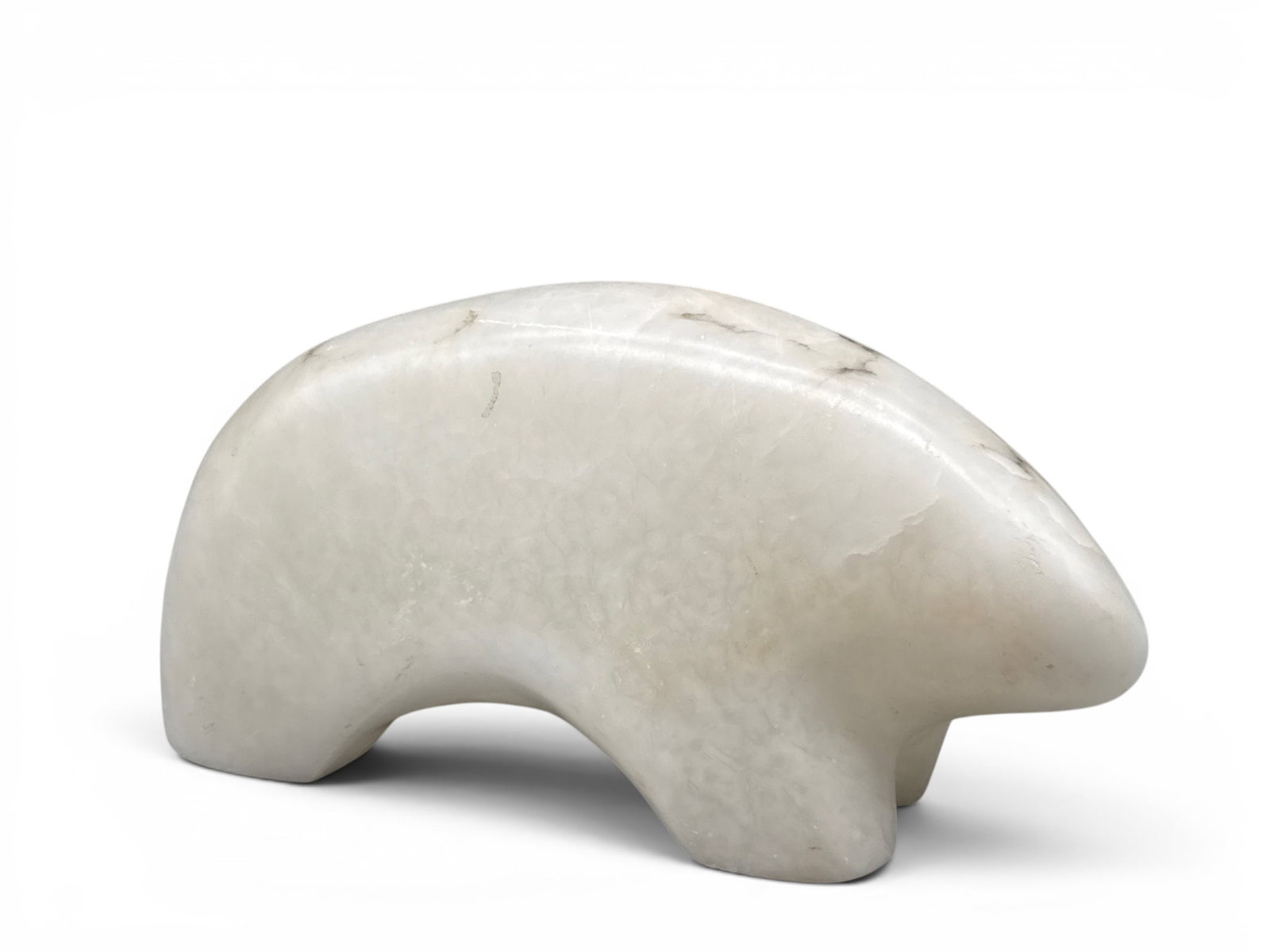 Alabaster Polar Bear Sculpture: A carved alabaster sculpture of polar bear form. 8in tall x 13in wide. | You have additional shipping options, and are not required to use Live Shipping. Additional shipping and delivery details are a