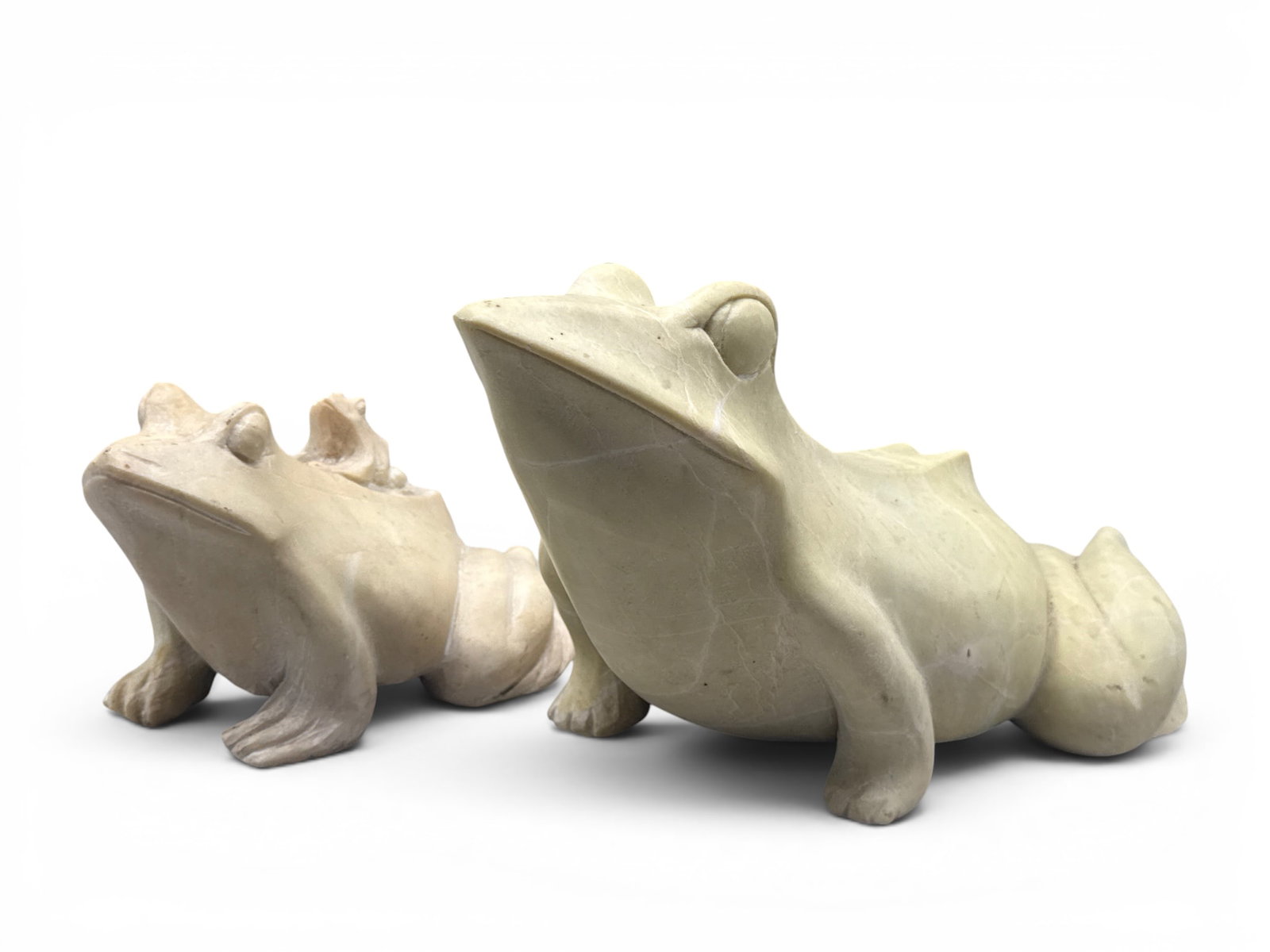 Two Carved Soapstone Frog Sculptures: A pair of carved soapstone figures of frog form. Larger: 7in tall x 13in wide. | You have additional shipping options, and are not required to use Live Shipping. Additional shipping and delivery detai