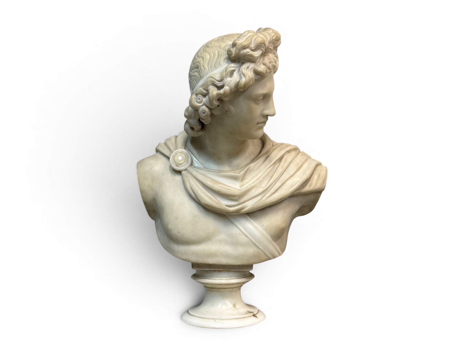 White Marble Bust of the Apollo Belvedere: A carved white marble bust depicting the Apollo Belvedere. 23-1/2in tall x 15-1/2in wide. | You have additional shipping options, and are not required to use Live Shipping. Additional shipping and del